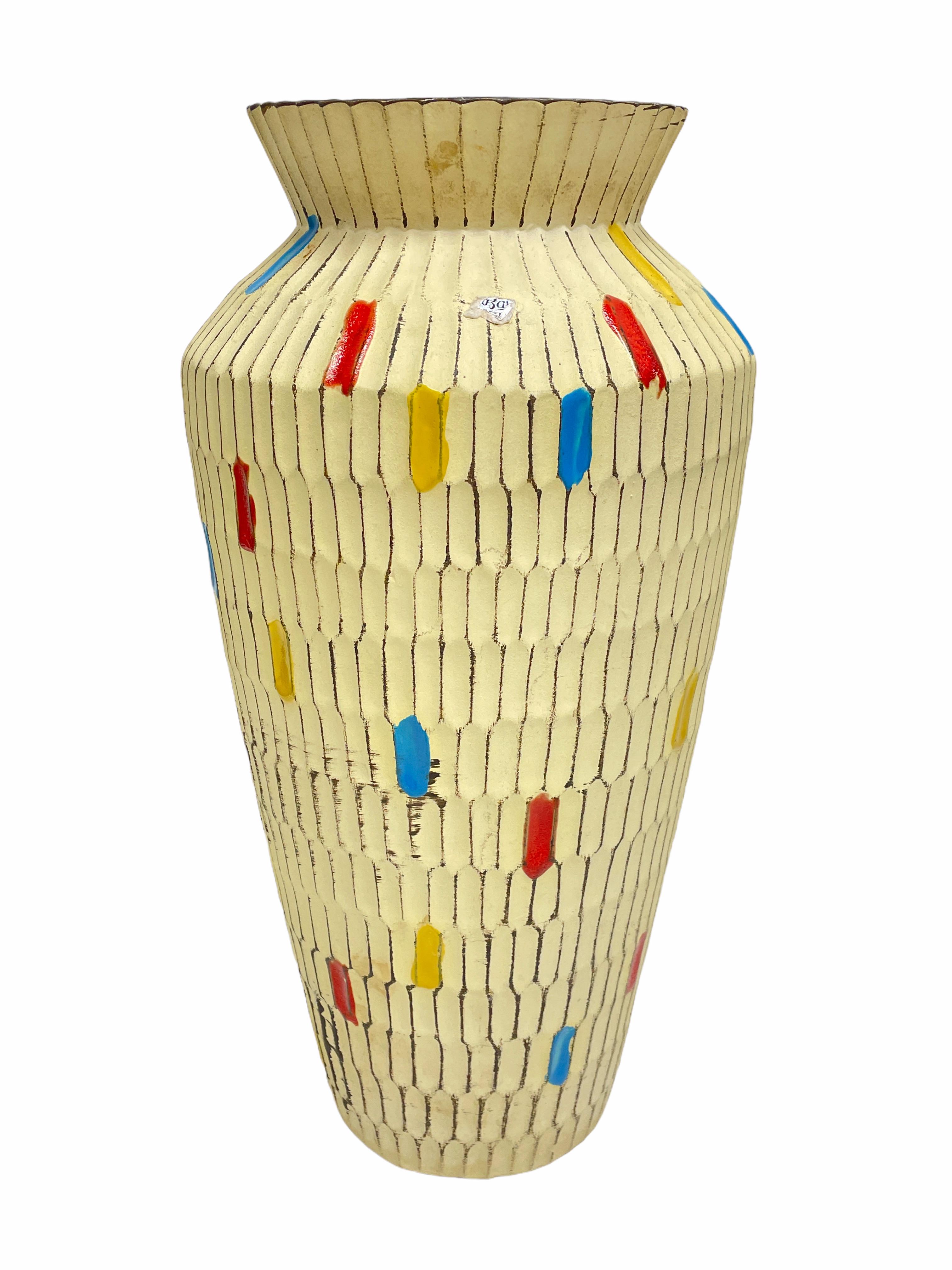 An amazing midcentury studio art pottery vase made in Germany, circa 1950s. Vase is in very good condition with no chips, cracks, or flea bites. Signed with parts of the old Label.