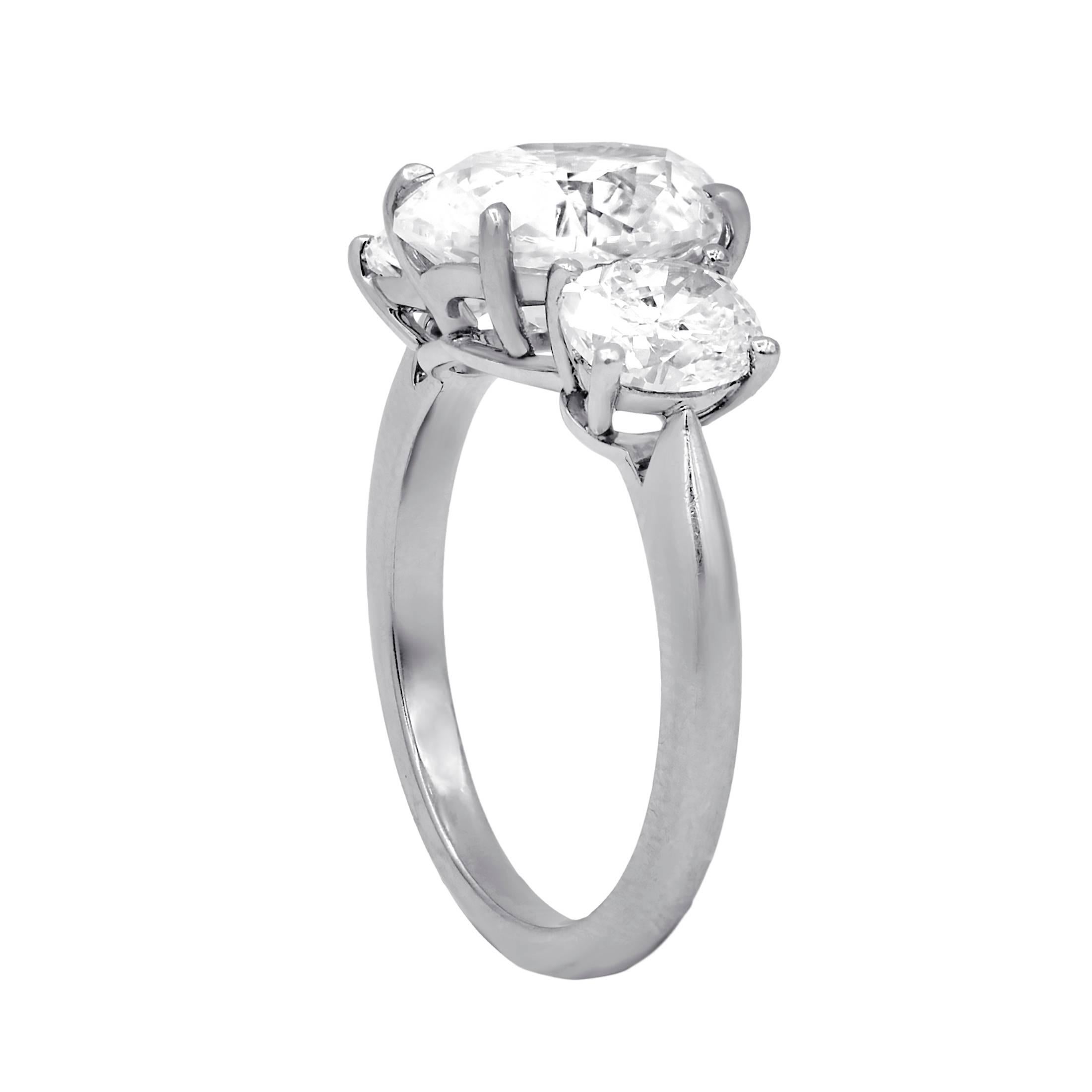 Elegant diamond engagement ring with three oval cut diamonds in platinum mounting.
The center GIA certified oval brilliant cut diamond features 3.26 cts F color/VVS2 clarity and enhanced by two side oval diamonds with 1.54 cts total weight. 

•
