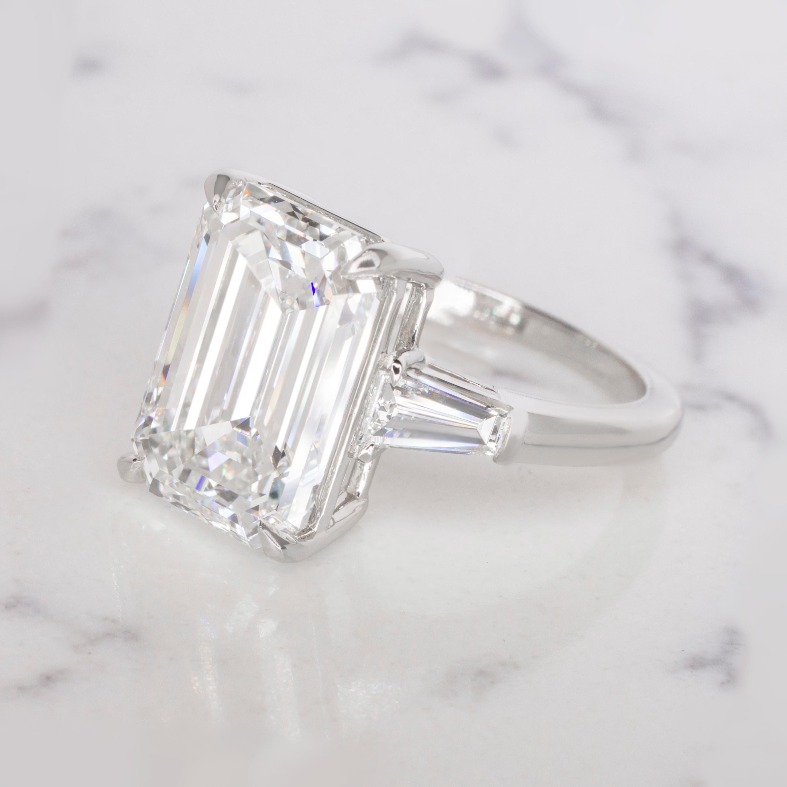 Elevate your sense of sophistication with this enchanting GIA-certified Emerald-Cut Diamond Ring, a true masterpiece of elegance and timeless allure.

Center Diamond:
At the heart of this exquisite ring is a GIA-certified, emerald-cut diamond,