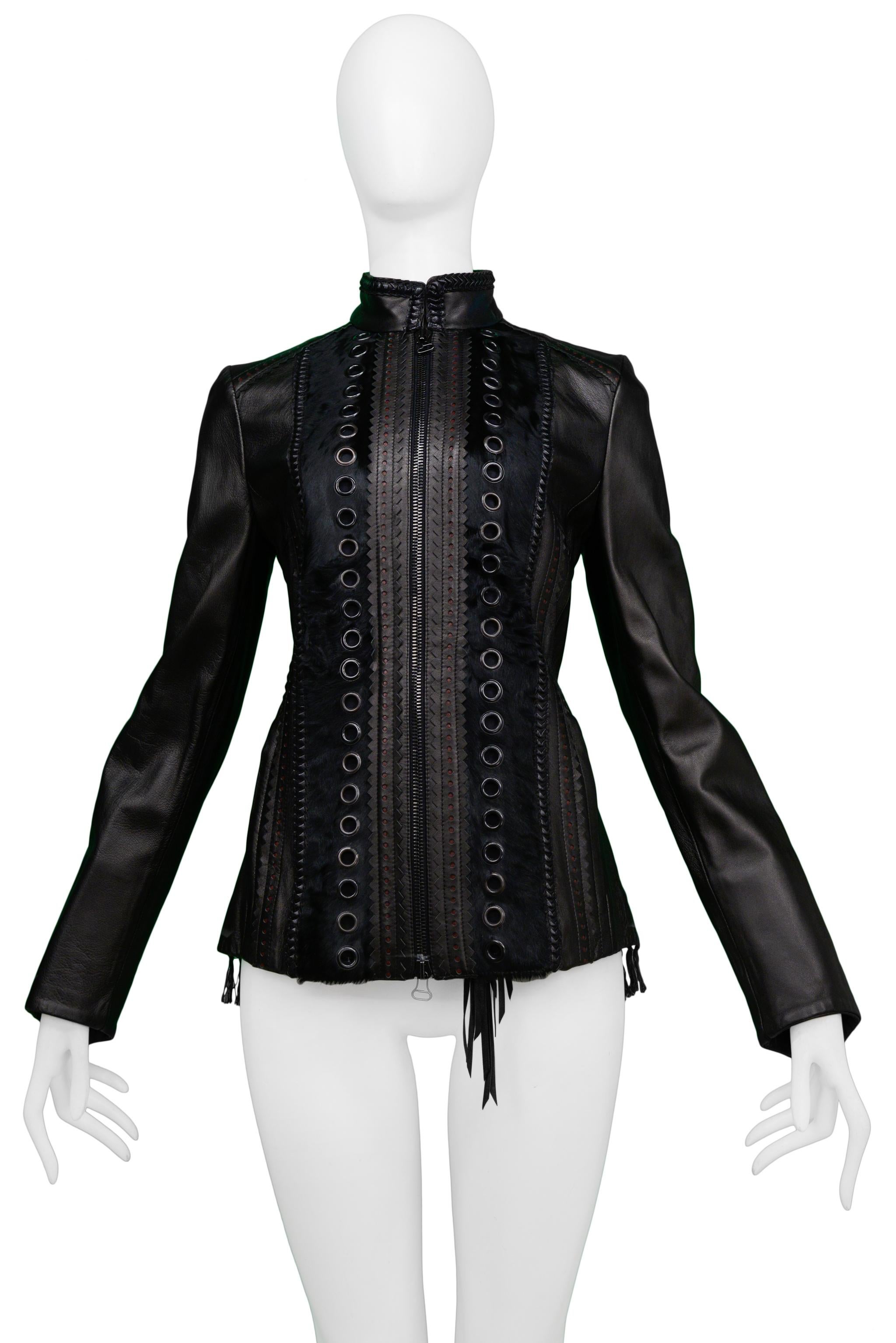 Resurrection Vintage is excited to offer a vintage Gianfranco Ferre black leather motorcycle jacket featuring a high collar, pony hair insets, whipstitching, decorative black leather trim, large gunmetal grommets, rows of small silver-tone grommets,