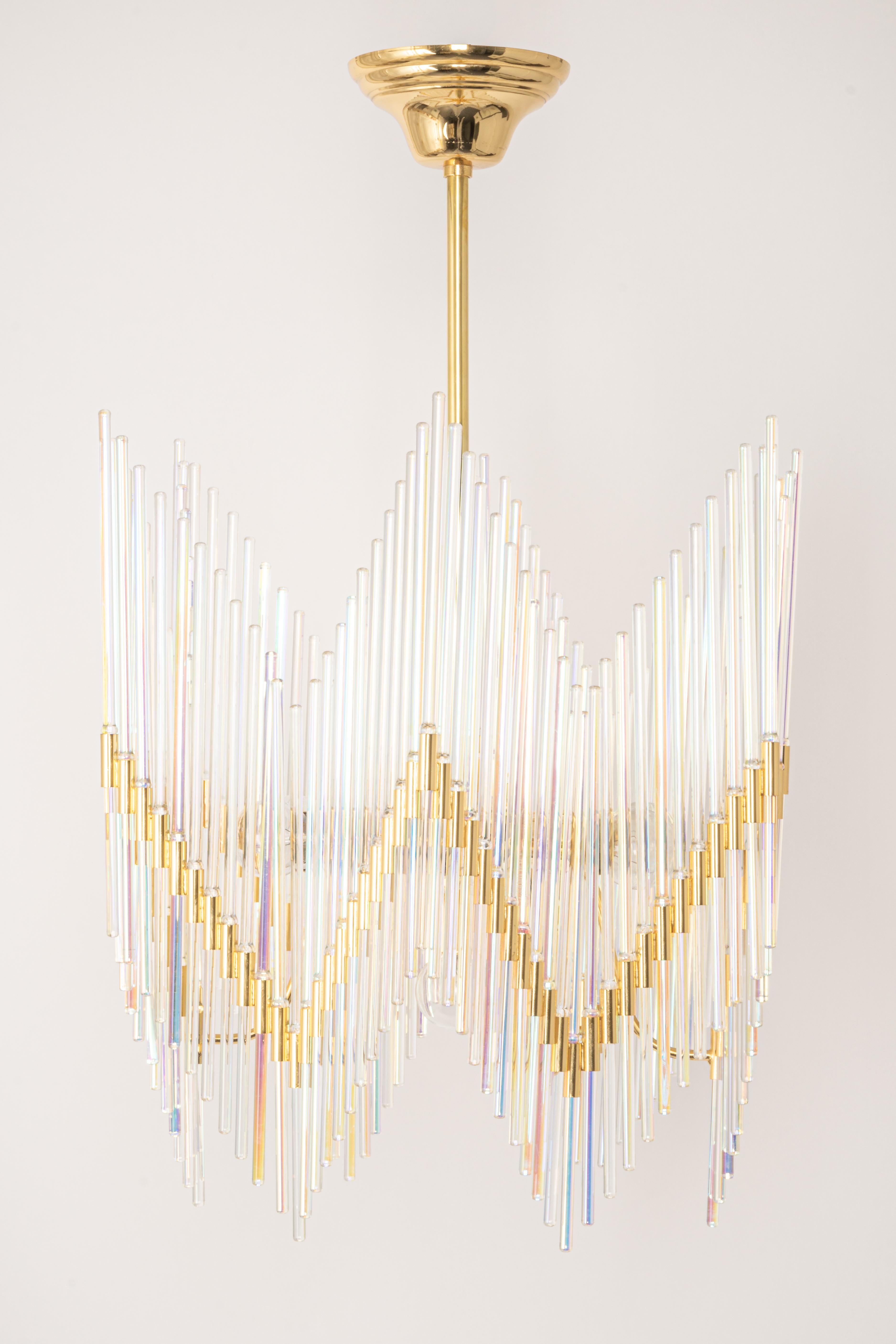 A stunning chandelier by Palwa (Palme and Walter), Germany, manufactured in 1960s. It’s composed of crystal glass rods on gilt brass frame.

Sockets: It needs 5 x E14 small bulbs ( max. 40 Watts each)
Light bulbs are not included. It is possible to