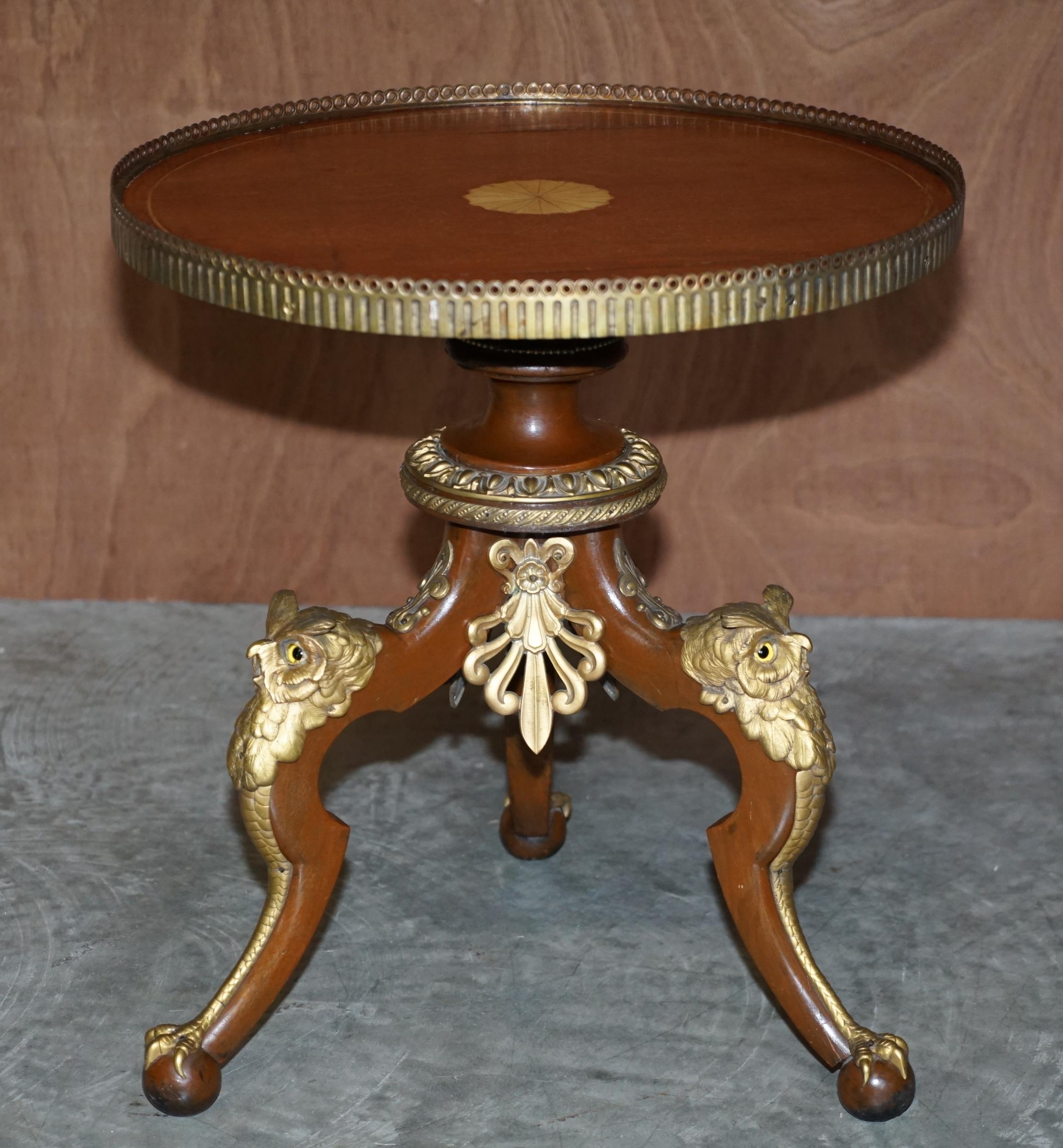 We are delighted to offer for sale this lovely very charming mahogany side table with gilt gallery rail, Sheraton revival inlaid top and gold gilt bronze Owls to the legs

This has to be the most decorative and charming table I have seen all year!