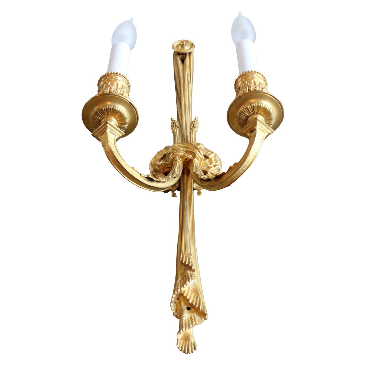 Stunning pair of French gilt wall sconces in the Louis XVI style.