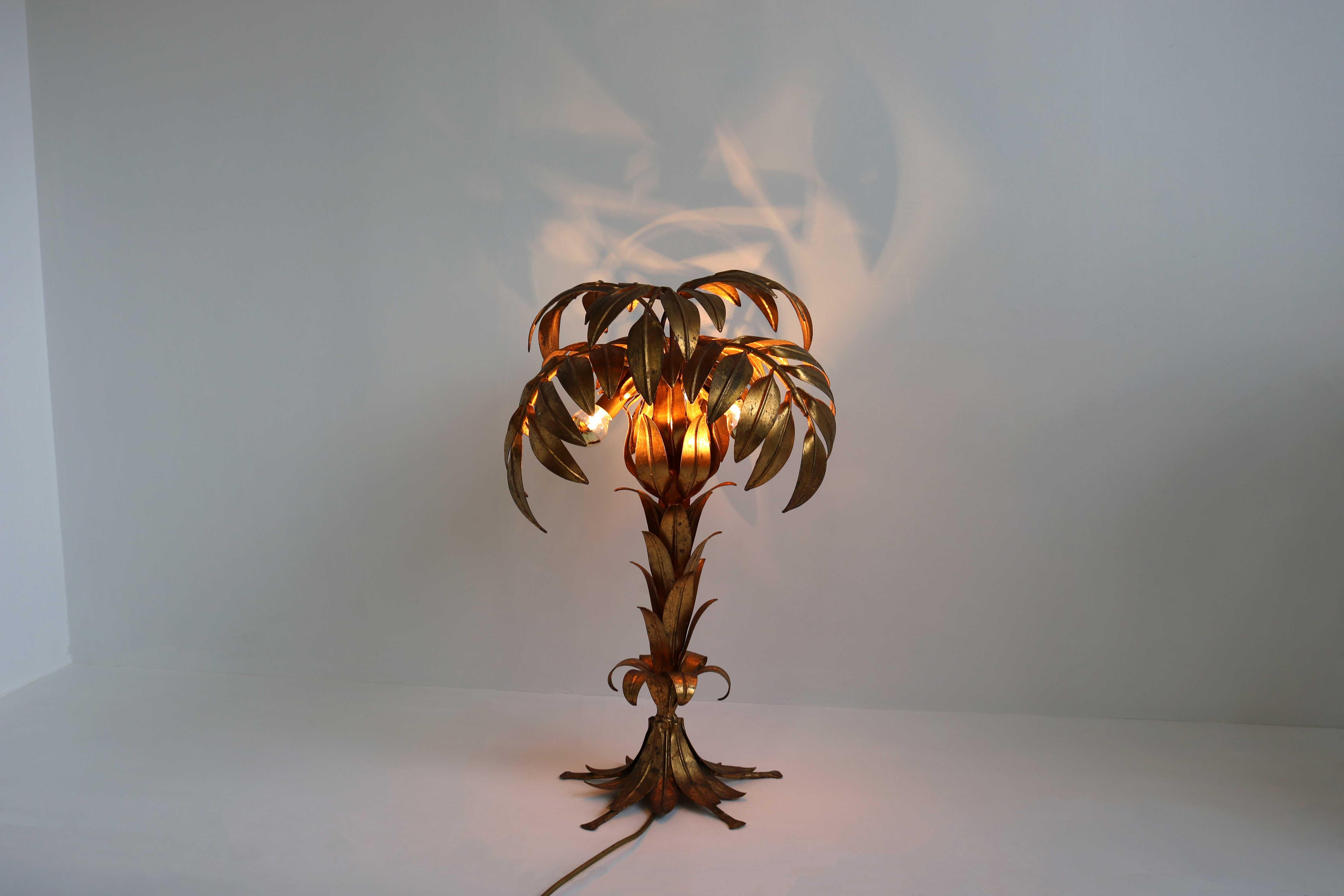 Impressive patinated gilt metal palm tree table lamp by German designer Hans Kögl, 1970s
With three small light points under the leafs gives this design lamp atmospheric light.
A wonderful model out of there palm tree series that's attracts