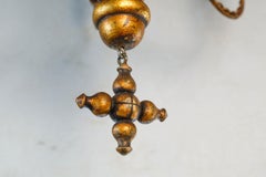 Carved Gilt  Italian Chandelier of Metal and Wood with  playful design.