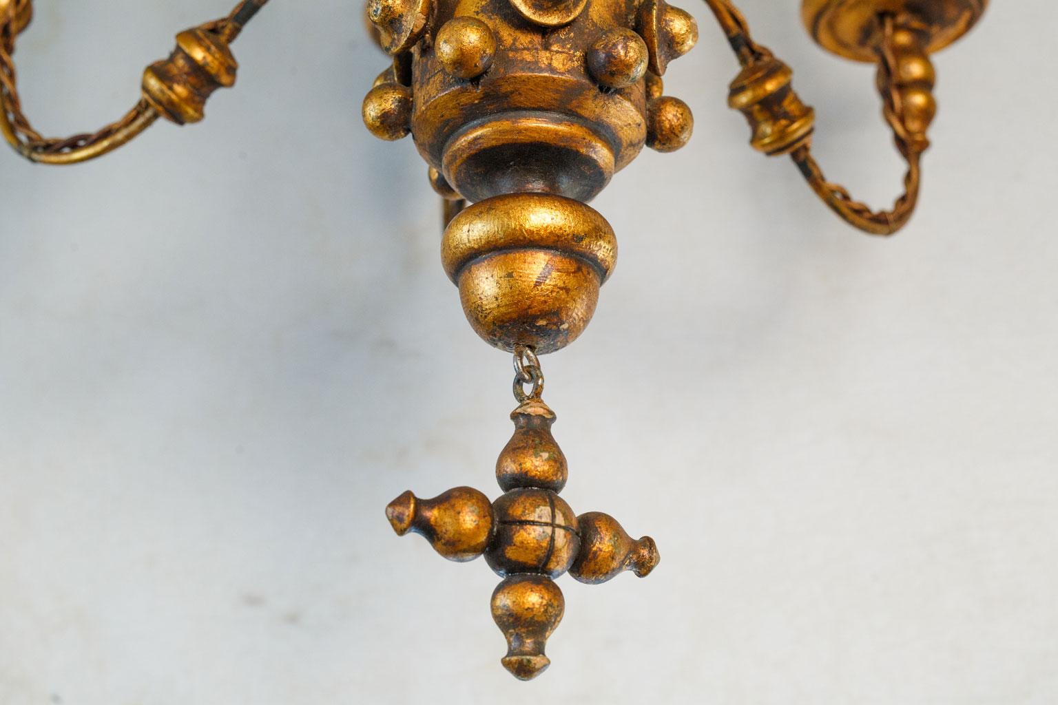 Baroque Stunning Gilt  Italian Chandelier of Metal and Wood with  playful design.  For Sale