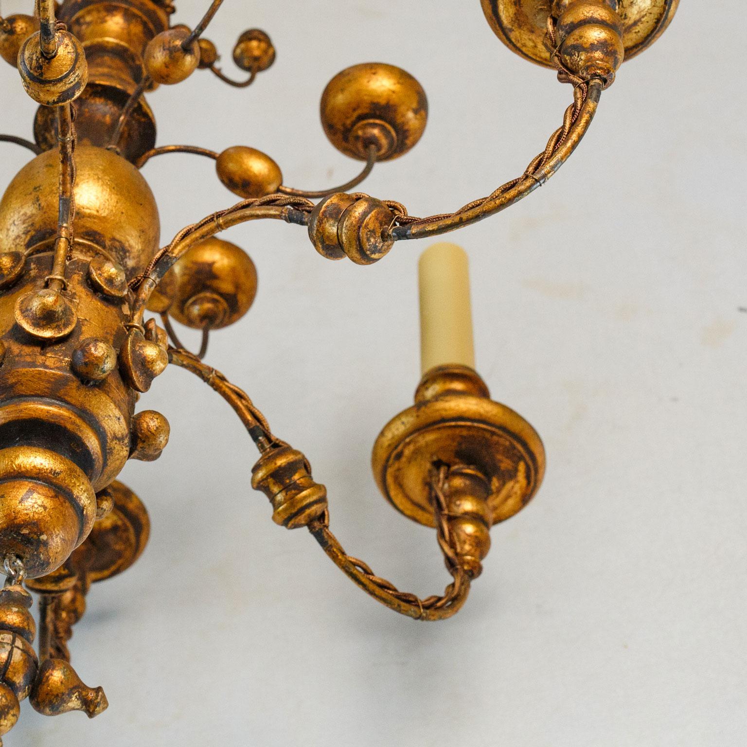 Stunning Gilt  Italian Chandelier of Metal and Wood with  playful design.  In Good Condition For Sale In Houston, TX