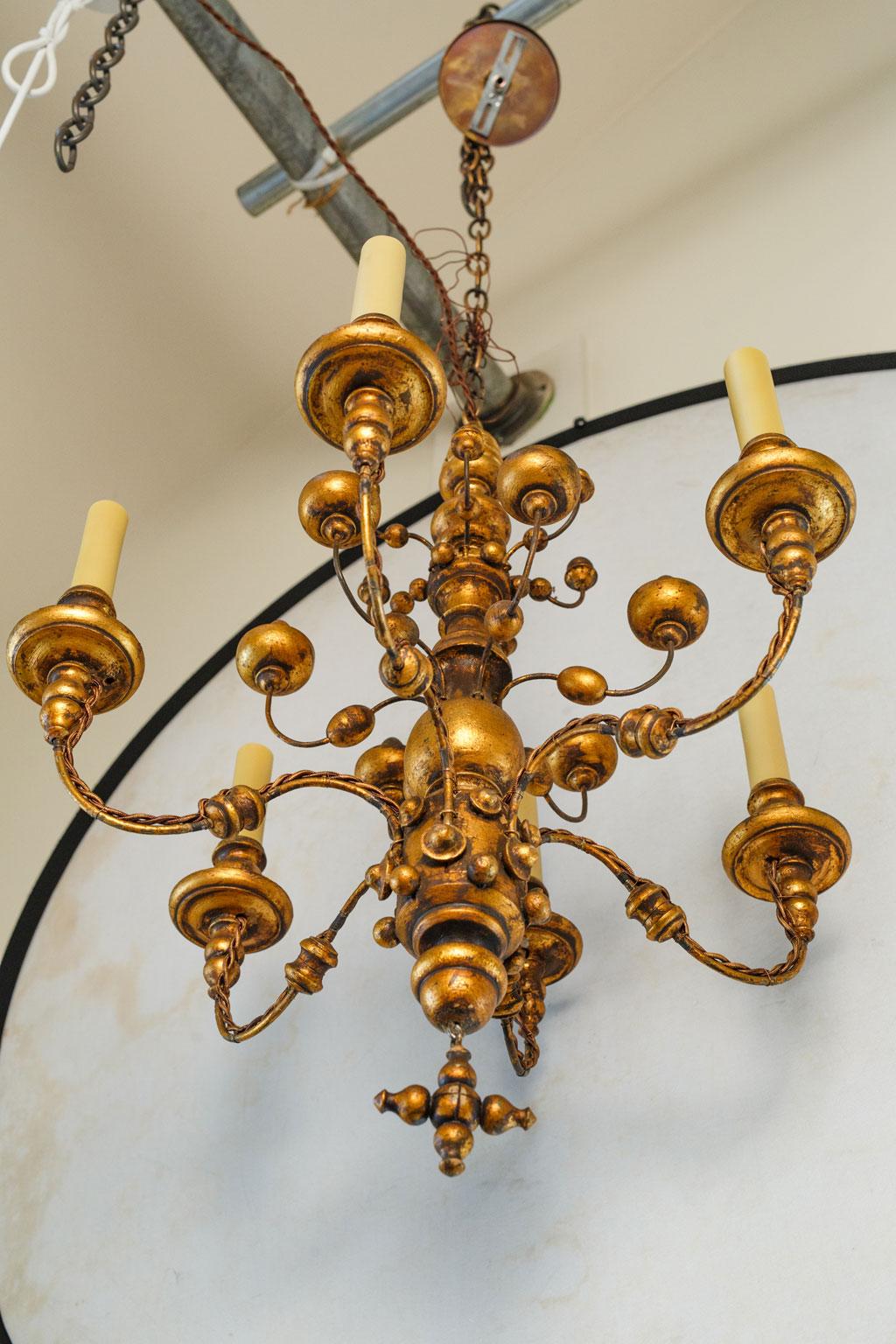 Iron Stunning Gilt  Italian Chandelier of Metal and Wood with  playful design.  For Sale