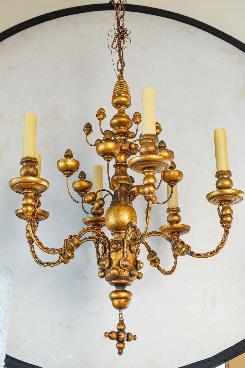 Stunning Gilt  Italian Chandelier of Metal and Wood with  playful design.  For Sale 1