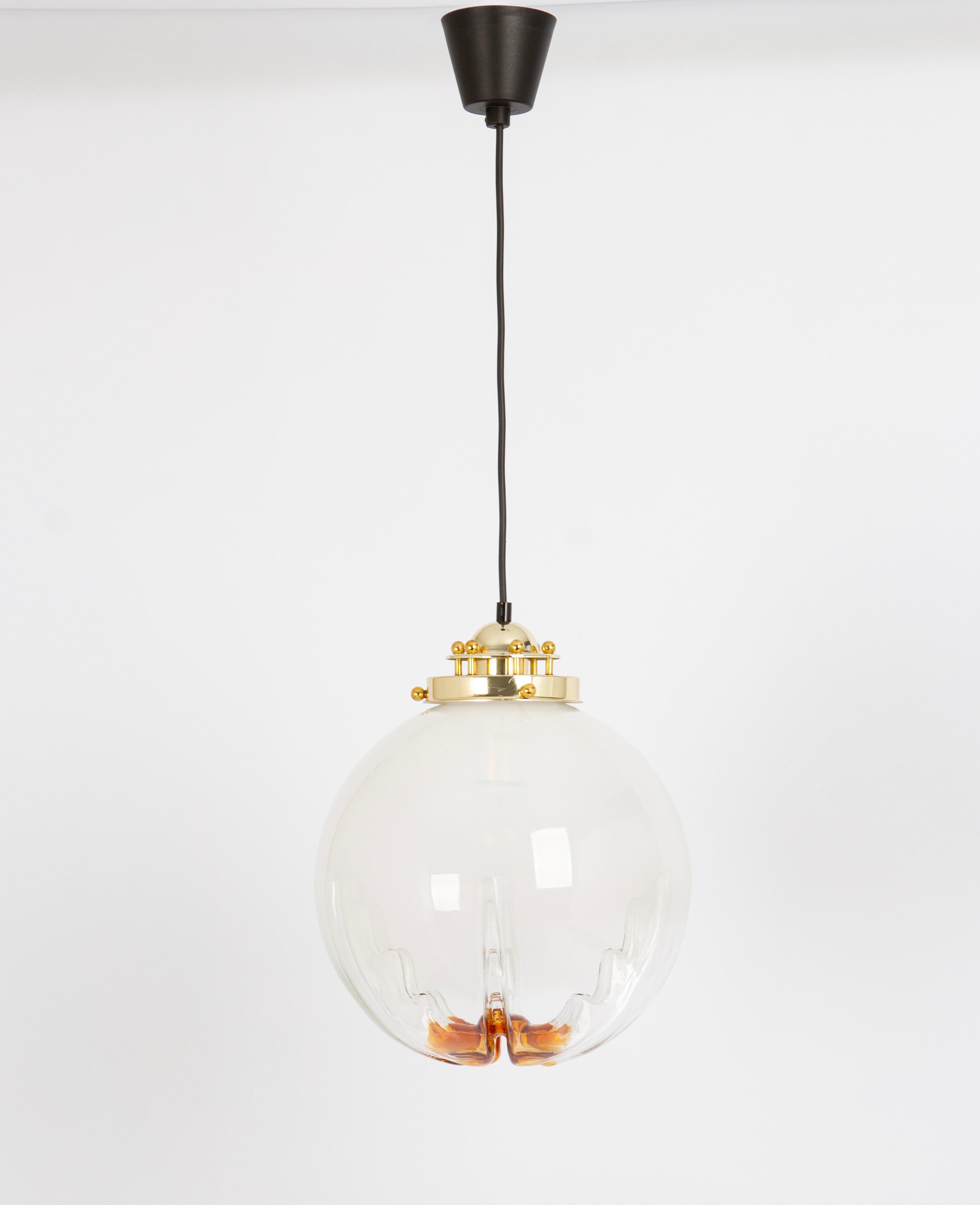 A stunning glass in the style of  Mazzega, Italy, 1960s.
Diameter: 30 cm // 11.8 inches
Wonderful light effect.

Good condition with signs of age and use on the brass canopy. Cleaned, well-wired and ready to use. 
The fixture requires 1 x E27