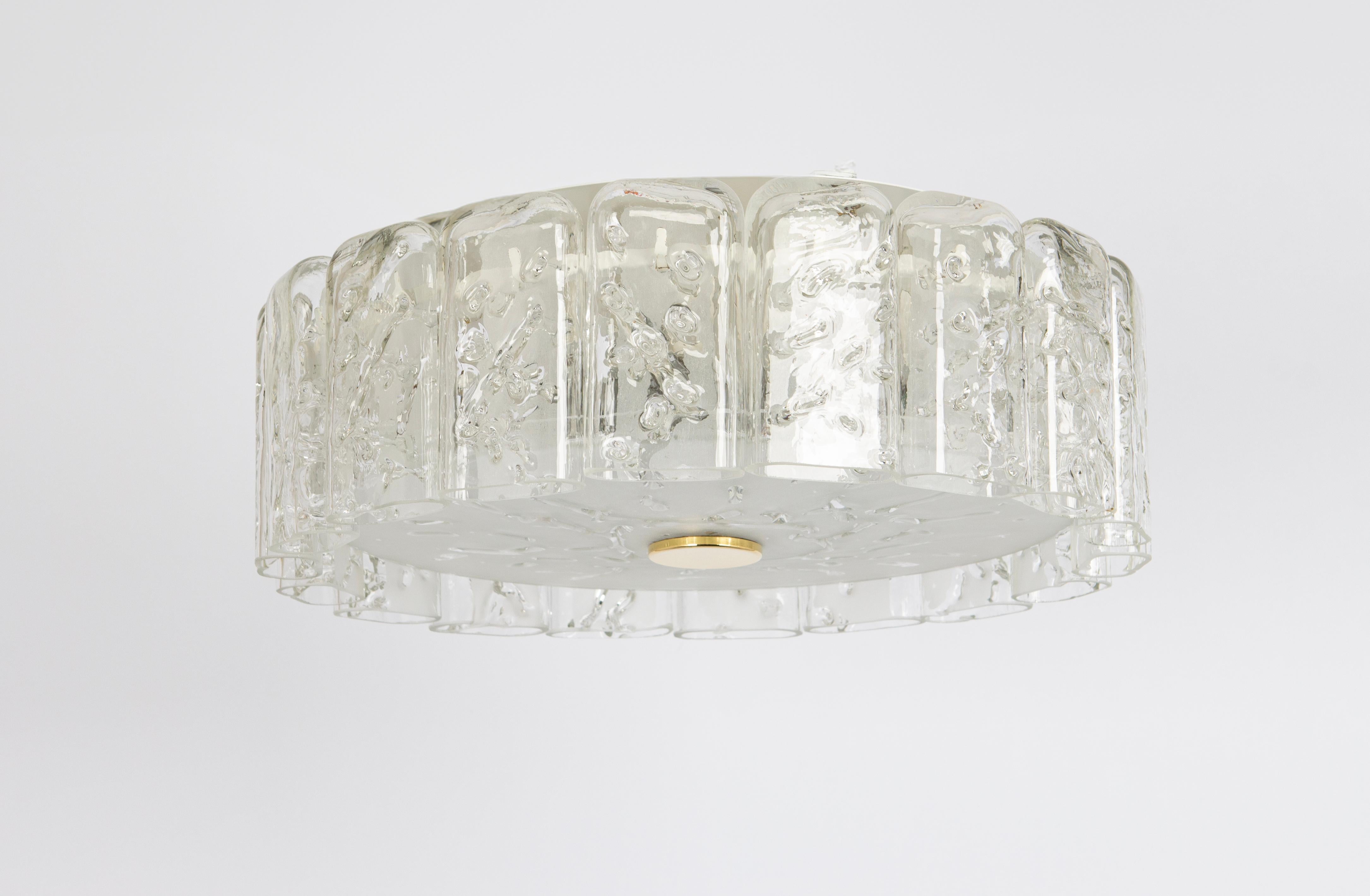 Fantastic mid-century chandelier by Doria, Germany, manufactured circa 1960-1969. Art Glass cylinders are suspended from the fixture.
High quality and in very good condition. Cleaned, well-wired, and ready to use. 

The fixture requires 6 x E14