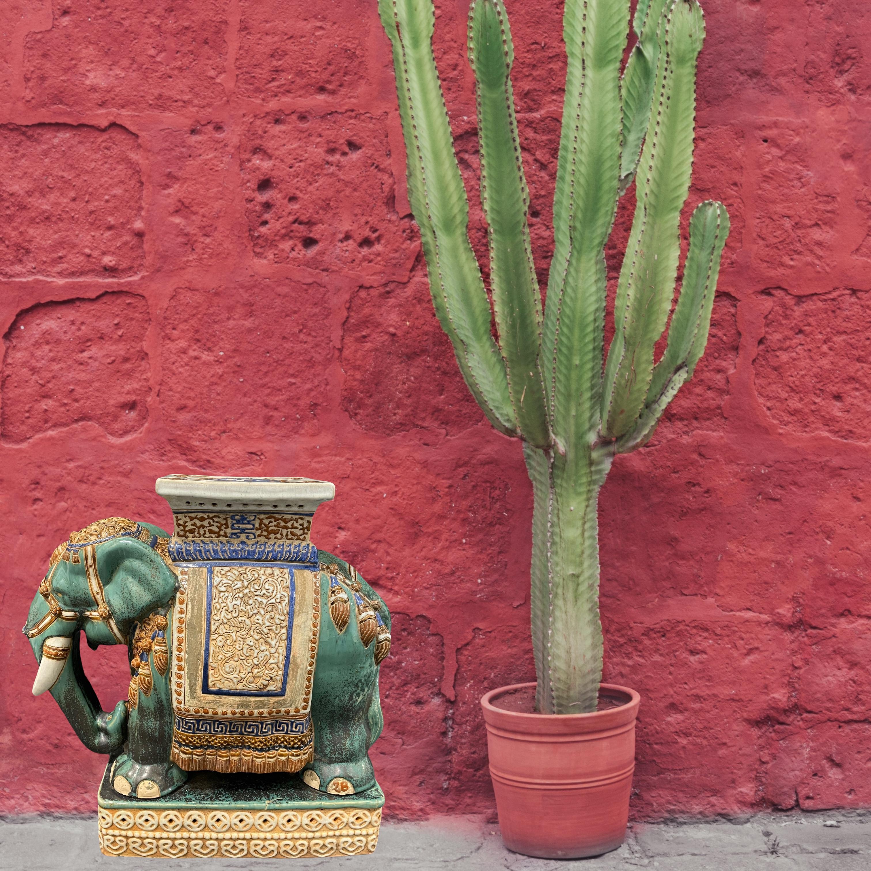 Mid-20th century glazed ceramic elephant garden stool, flower pot seat or side table. Handmade of ceramic. Nice addition to your home, patio or garden. A real gem, very heavy and in outstanding quality. A nice addition to any room, patio or yard.