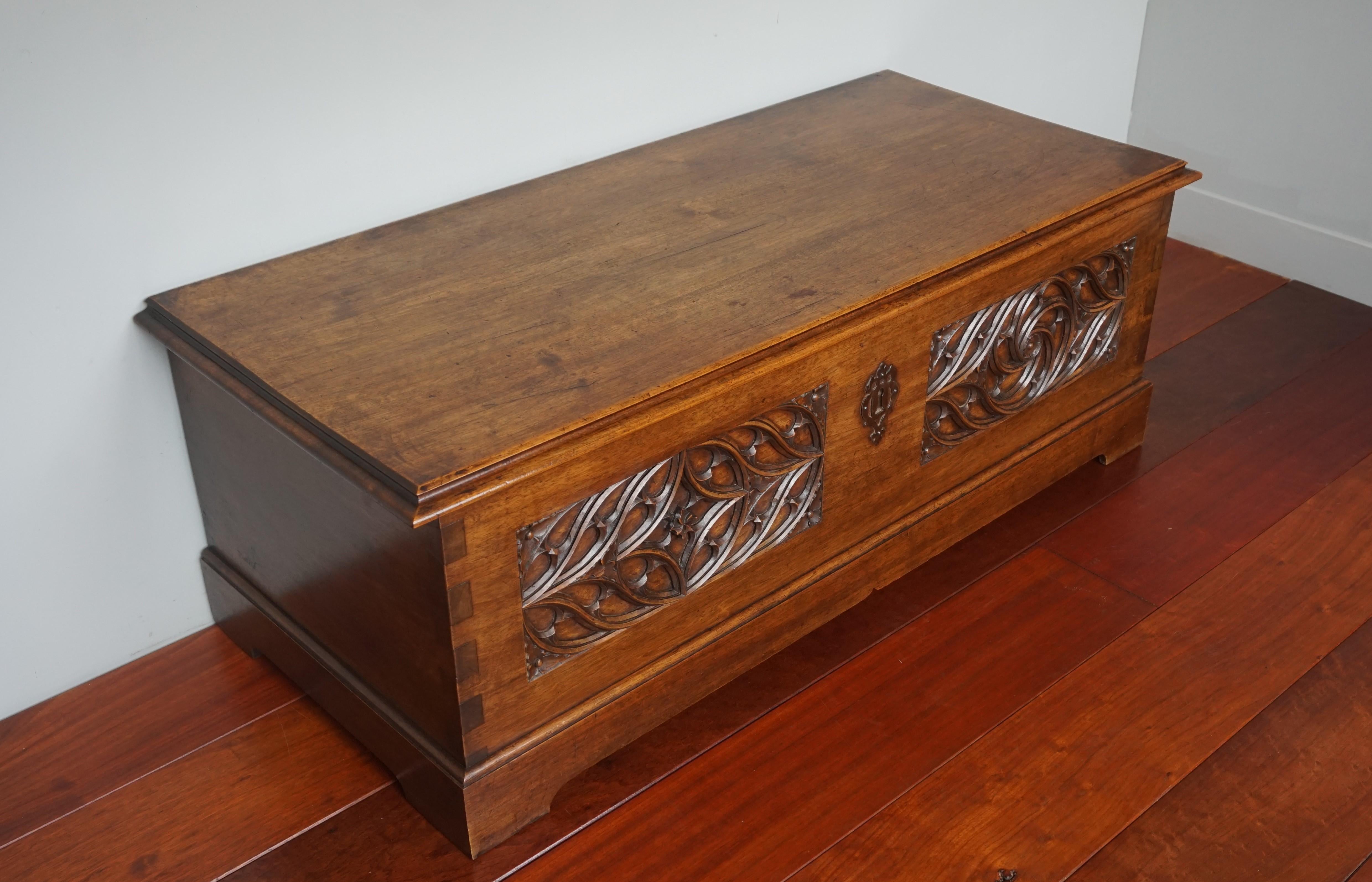 Marvelously hand carved and beautifully decorative Gothic chest.

Because of the quality of the carving, the beautiful overall design and the striking solid walnut structure we feel that this stylish and practical chest was handcrafted in France.