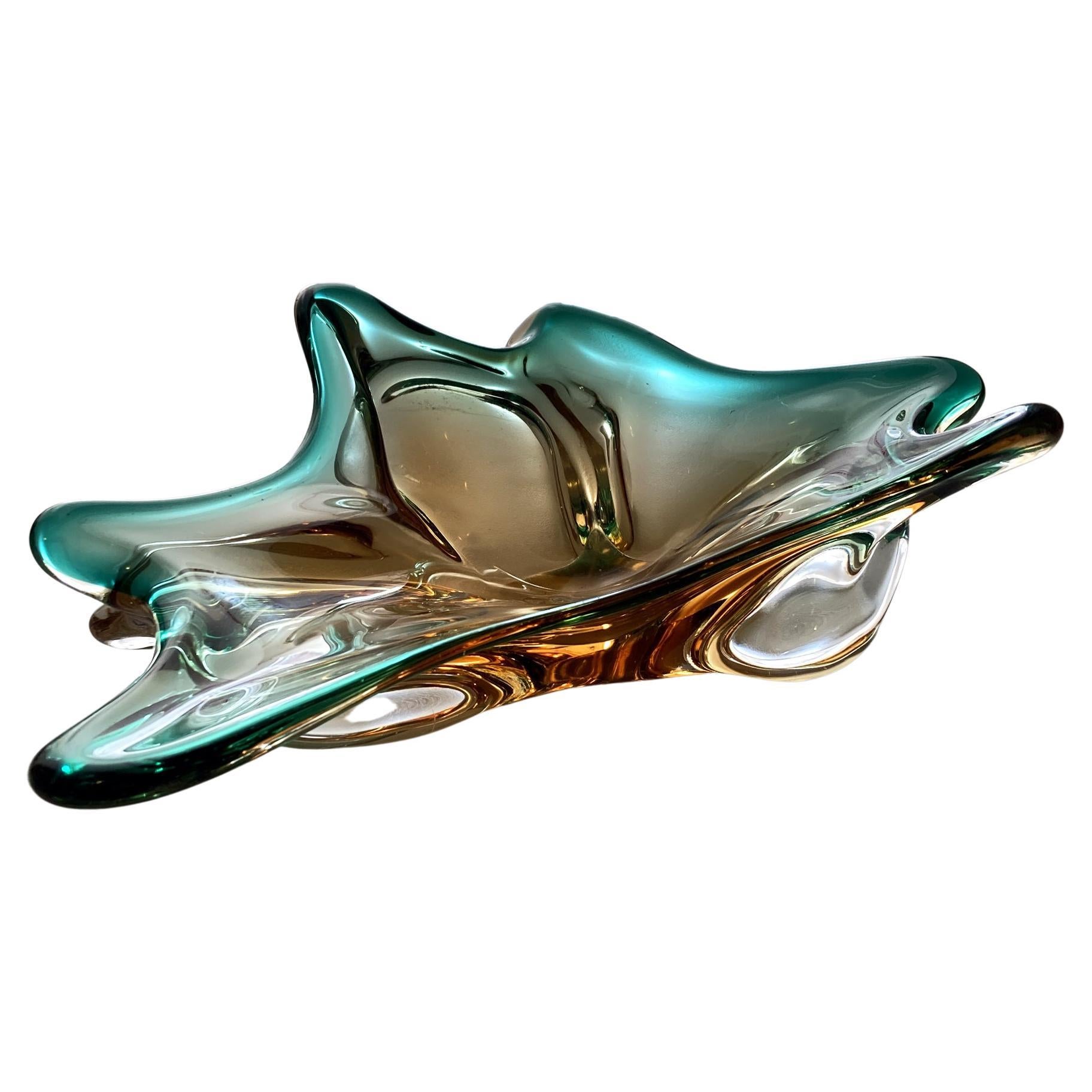 Stunning Murano hand blown centerpiece bowl in the sommerso technique of layered colored glass. Bold green and amber layers of glass glitter when the light hits this piece at different angles. In good vintage condition, no chips or cracks, minor