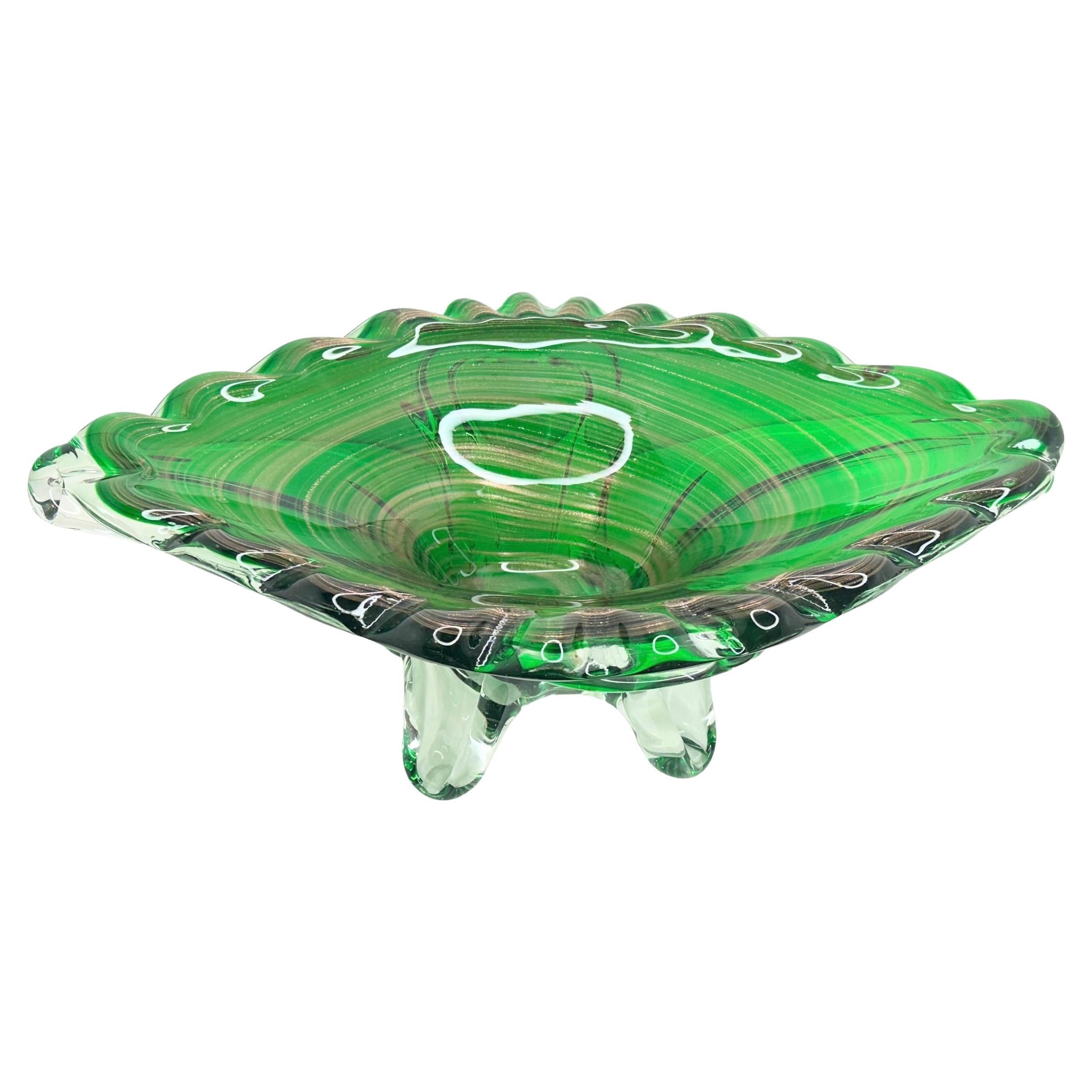 Gorgeous hand blown Murano art glass piece with Sommerso and bullicante techniques. A beautiful organic shaped bowl, catchall or centrepiece, Venice, Murano, Italy. Colors are green and clear, with gold flake swirls from the inside to the outside. A