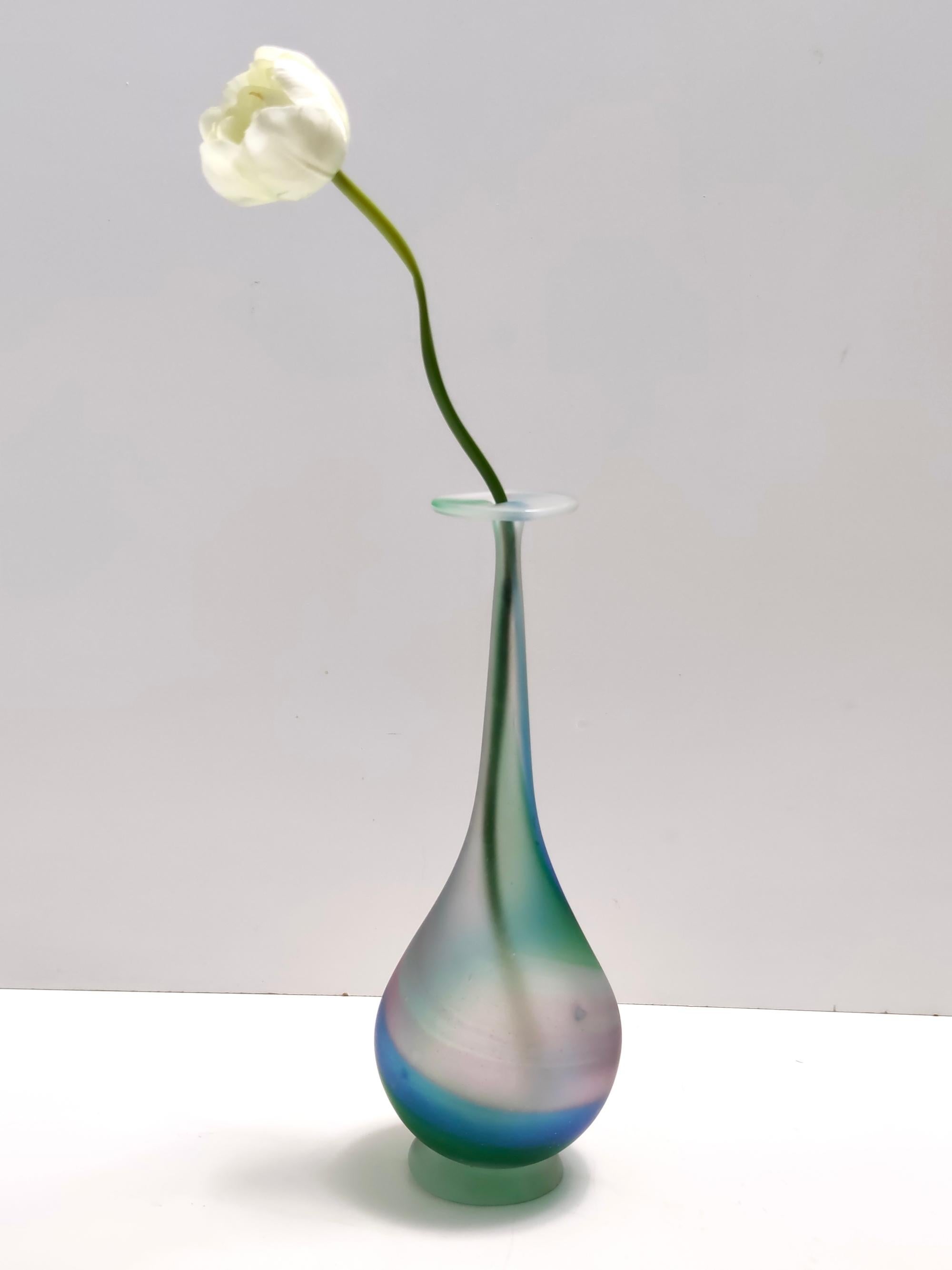 Made in Italy, 1970s. 
The tag refers to La Rinascente, a historic luxury department store based in Piazza Duomo in Milan: the most important Italian architects and designers worked for it.
The vase is signed and marked Murano, with its original