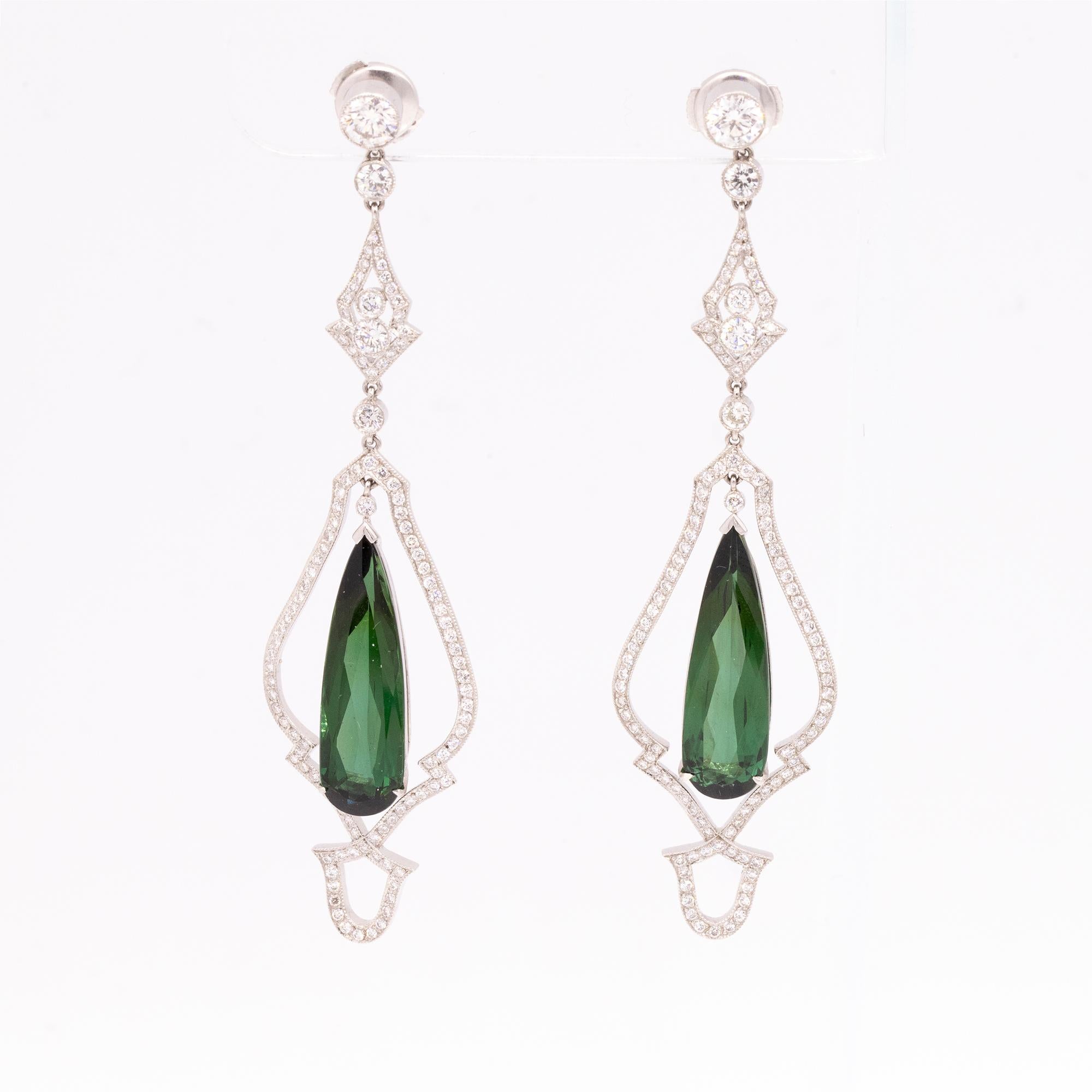 From our Heritage Collection, these stunning earrings epitomize show-stopping glamour and elegance. Presenting pear-shape green tourmalines with a brilliant diamond frame and top, these earrings are the height of craftsmanship and design. With fine