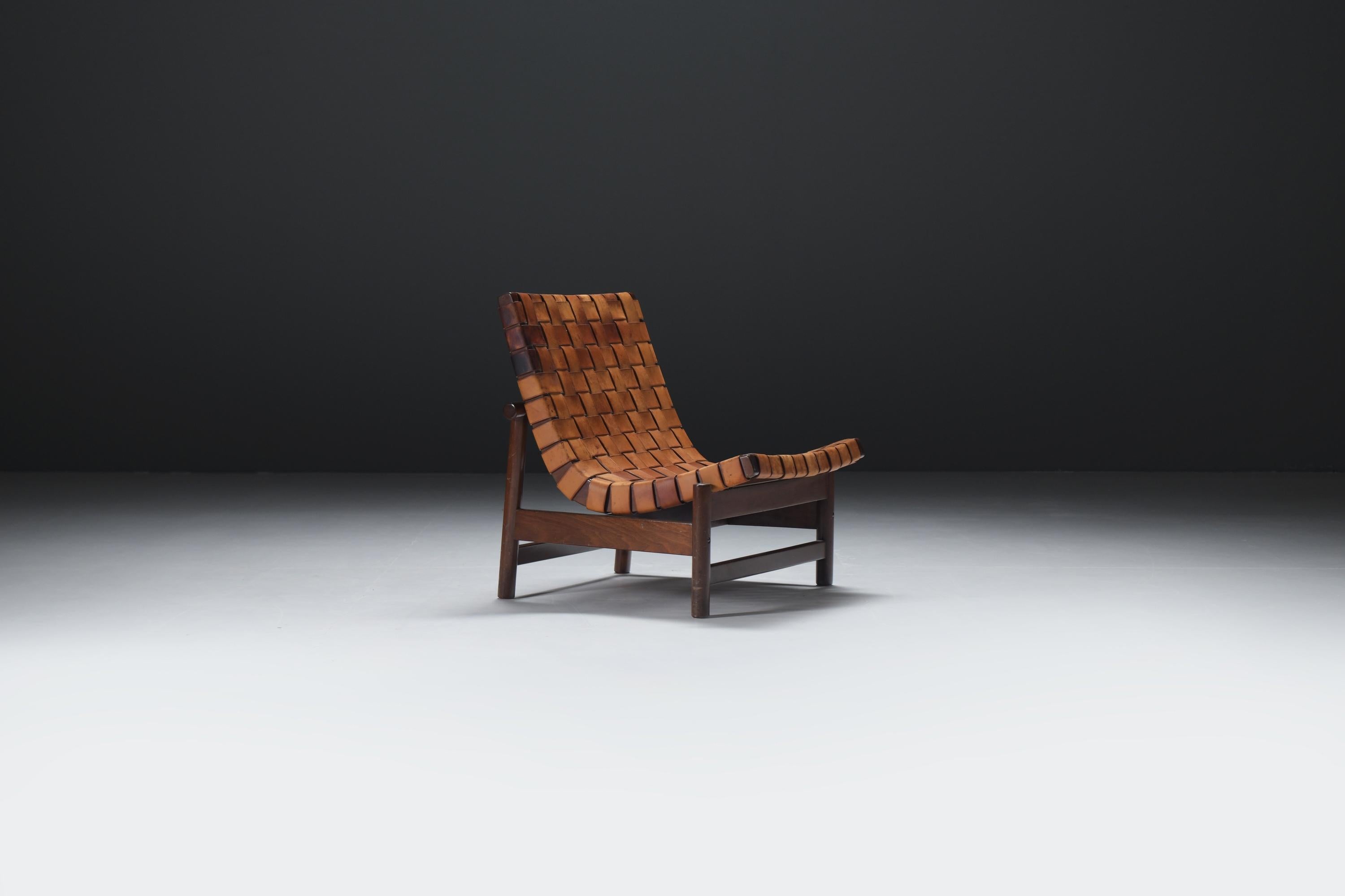 Designed in the late 1950s, the 'Guama' easy chair is a rare piece that features a mahogany wooden base with an original patinated cognac leather upholstery.  A remarkable find on the current market.
Designed by Gonzalo Cordoba for Dujo Cuba in