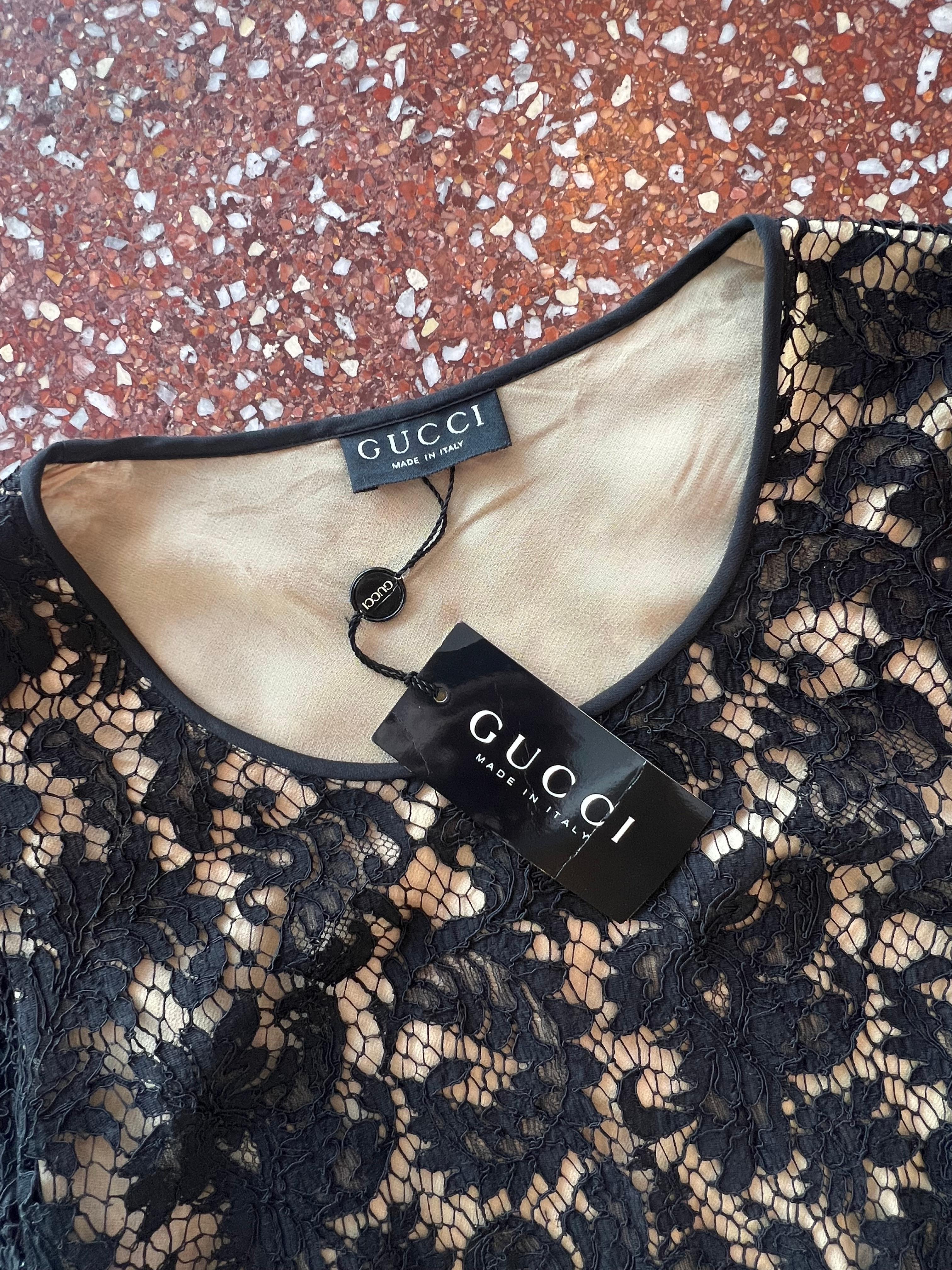 Resurrection Vintage is excited to offer a stunning vintage Tom Ford for Gucci black lace mini-dress featuring balloon sleeves with wrist ties, attached nude under slip, and scalloped edges. It was featured on the 1996 runway and in numerous fashion