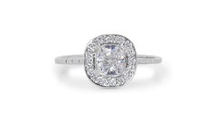 Stunning Halo Ring with a Dazzling 0.8 carat Cushion Shape Natural Diamond