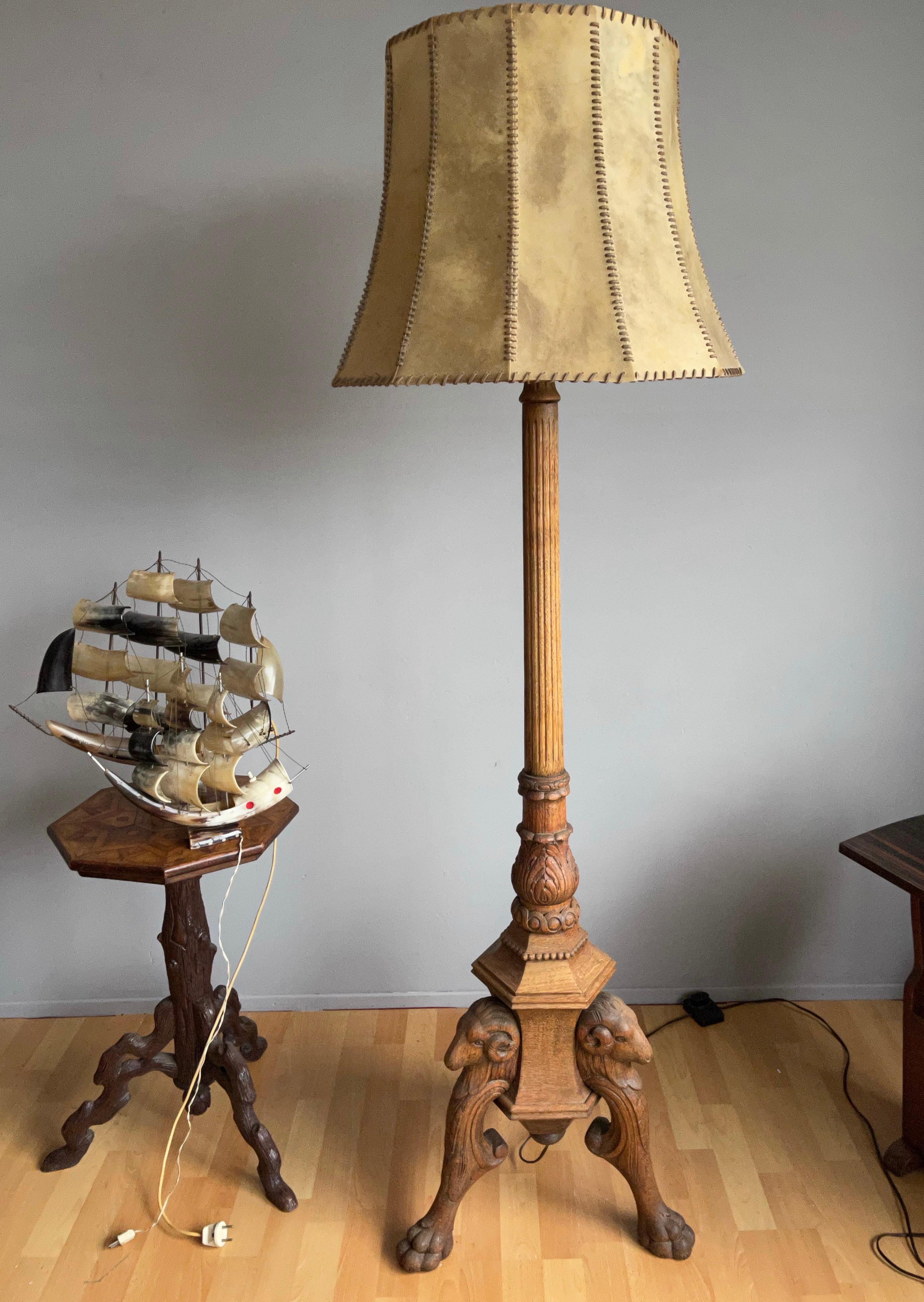 Unique and all handcrafted antique oak floor lamp with a hide and leather lace shade.

If you are looking for an incredibly well crafted, great looking, decorative and meaningful antique lamp for your home, library or office then this fine specimen