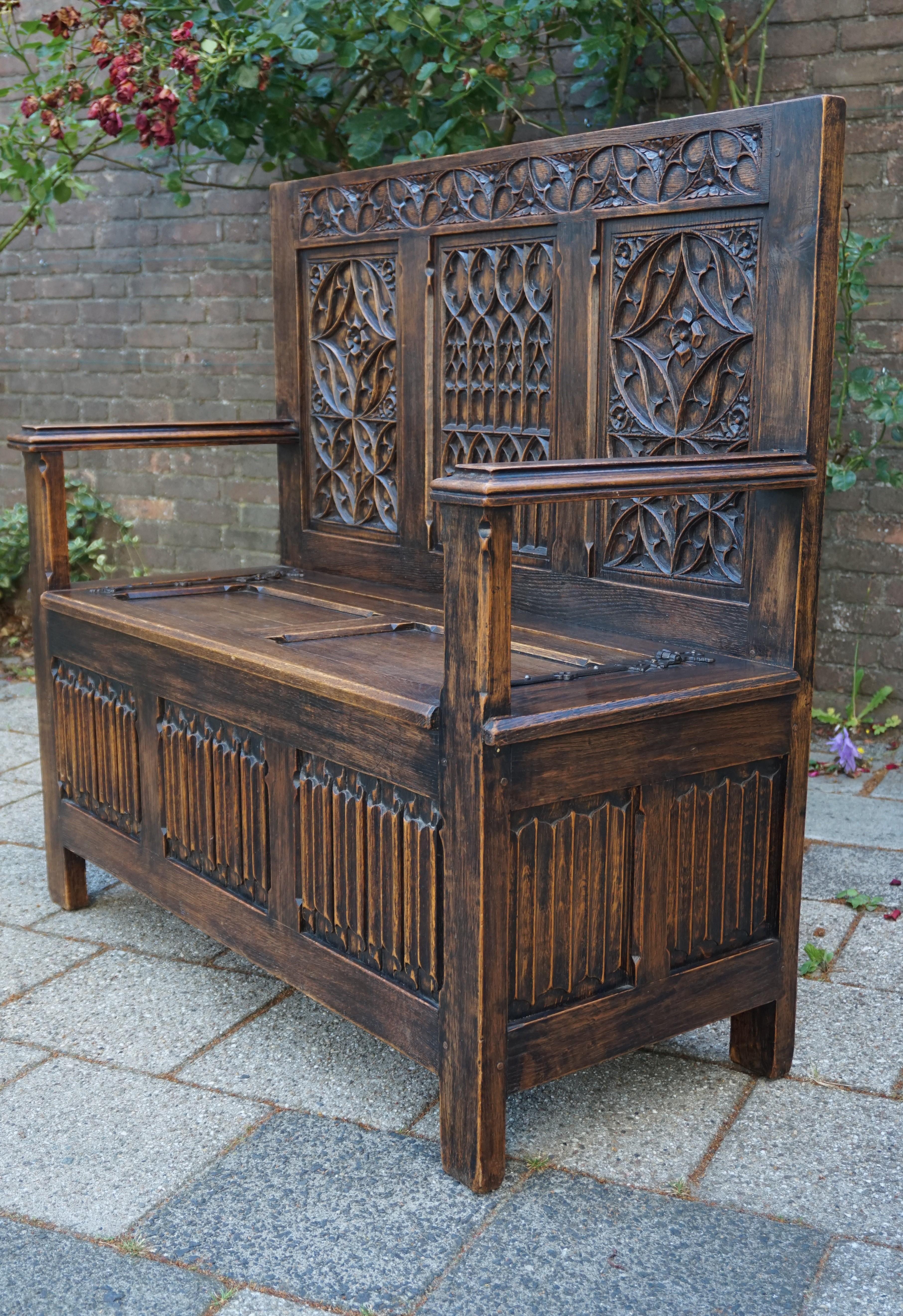 Rare Gothic bench with top quality carved, church window-like panels.

This beautifully and deeply carved, oak church bench from the early 1900s is in amazing condition. It comes with top quality carved details and you could not wish for a more