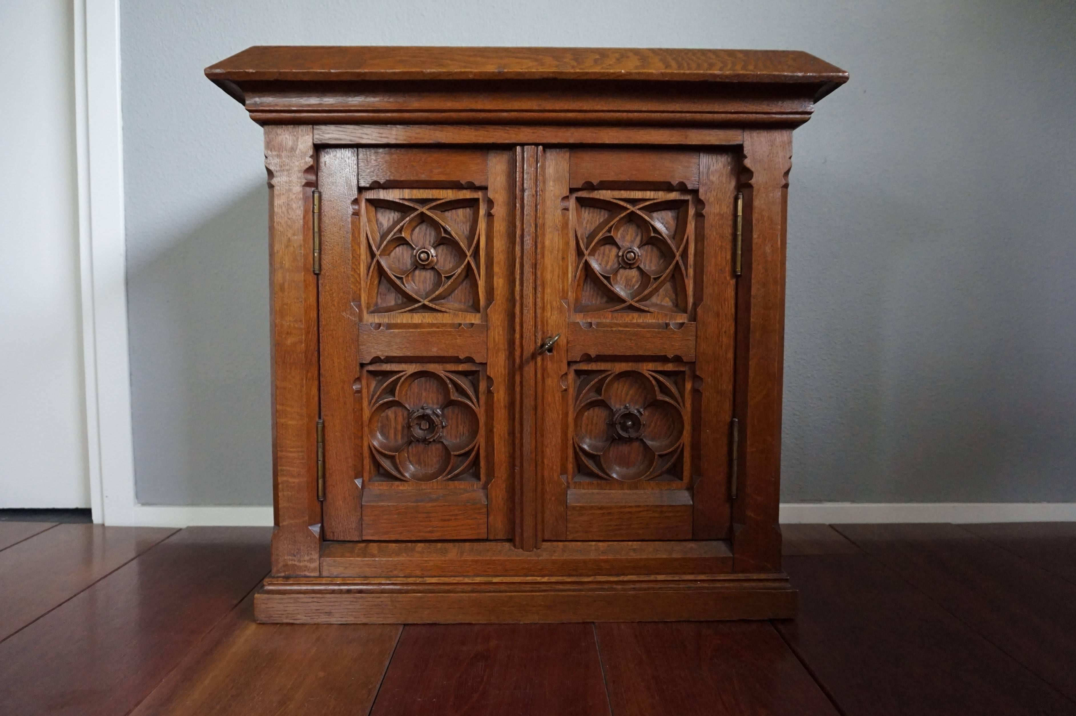 Small but glorious and strong cabinet.

This relatively small, but very well crafted and strong cabinet can be used for all kinds of purposes. It dates from the earliest days of twentieth century, it is unmistakably Gothic Revival in design, it has