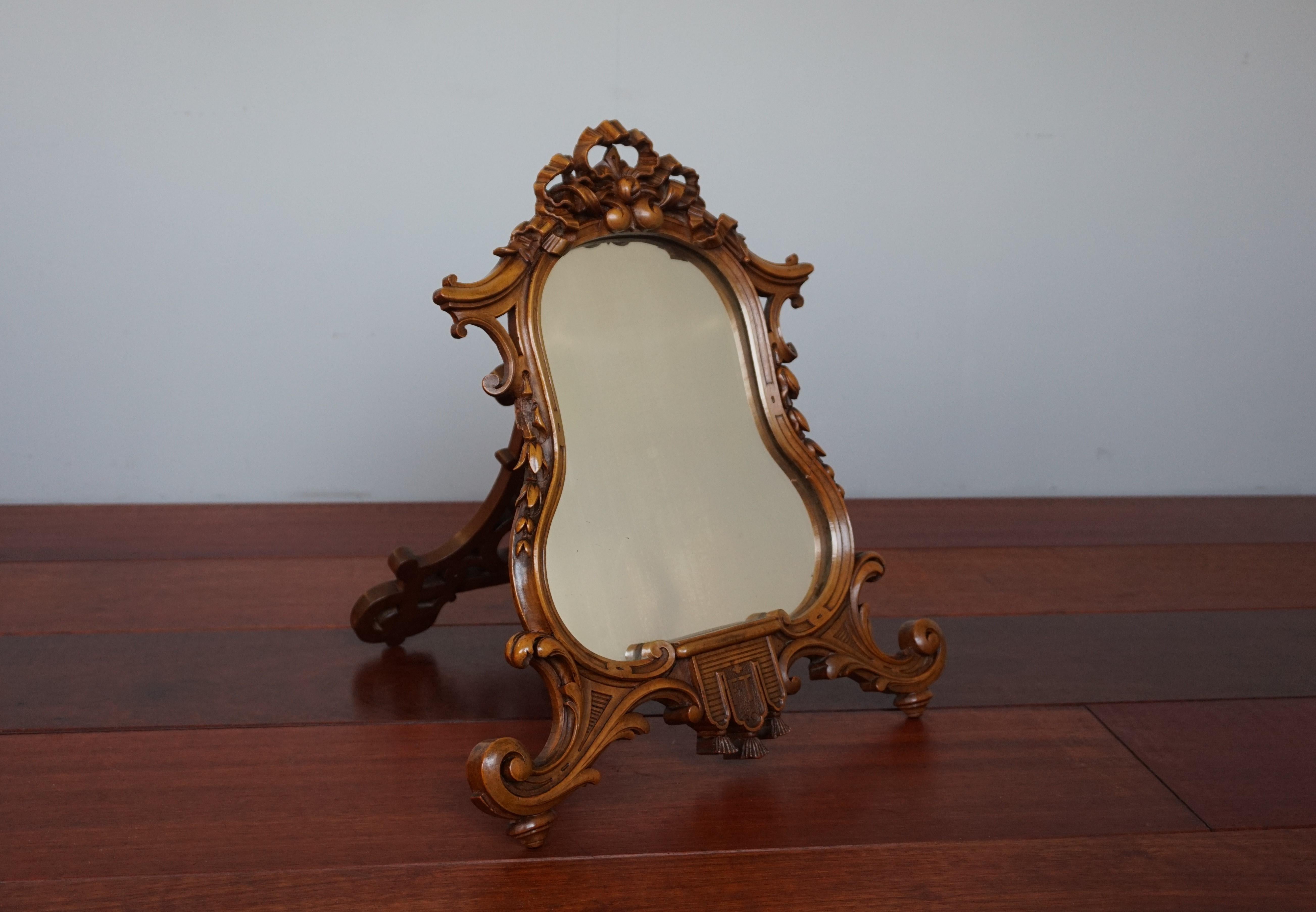 One of a kind table mirror by world famous Parisian makers and master carvers.

This table mirror was all handcrafted by the world famous Guéret Frères. This firm was founded in 1853 and continued in production until the end of the 19th century.