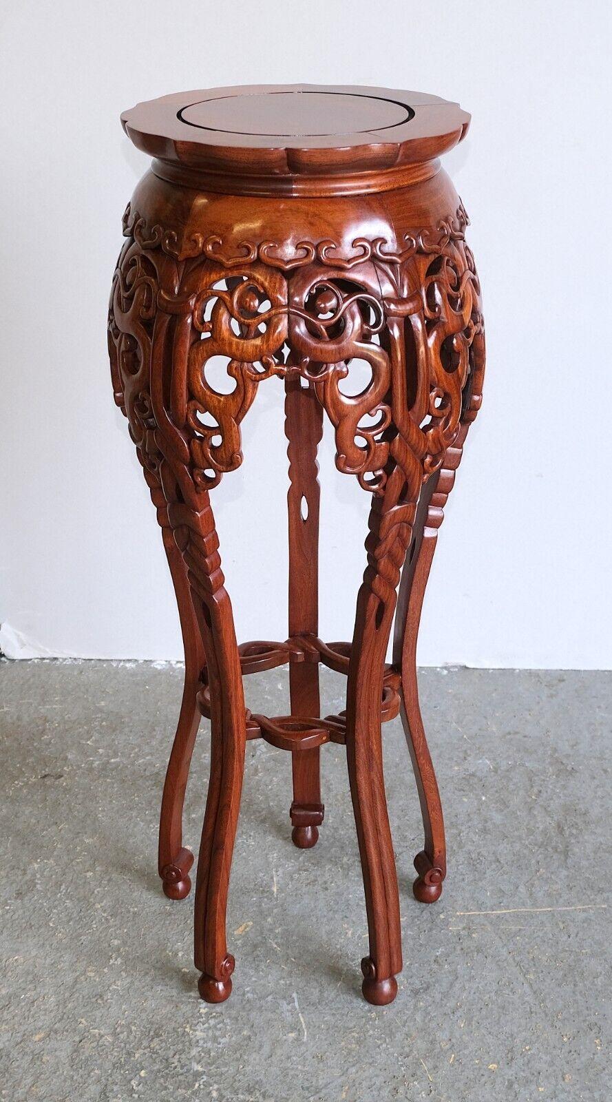We are delighted to offer for sale this gorgeous Chinese hand carved teak plant stand, petal shaped top and stunning legs.

This beautiful piece shows hand-carved motif decorations all around, which stand proudly in any room. The legs have soft nice