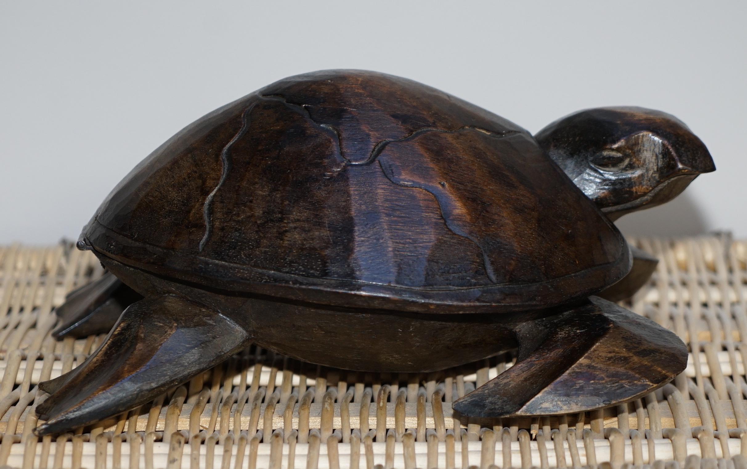 We are delighted to offer for sale this lovely hand carved sea turtle with internal storage space for jewelry

A good looking and beautifully hand carved piece, the entire back is hinged and it lifts off to reveal a small storage area

We have
