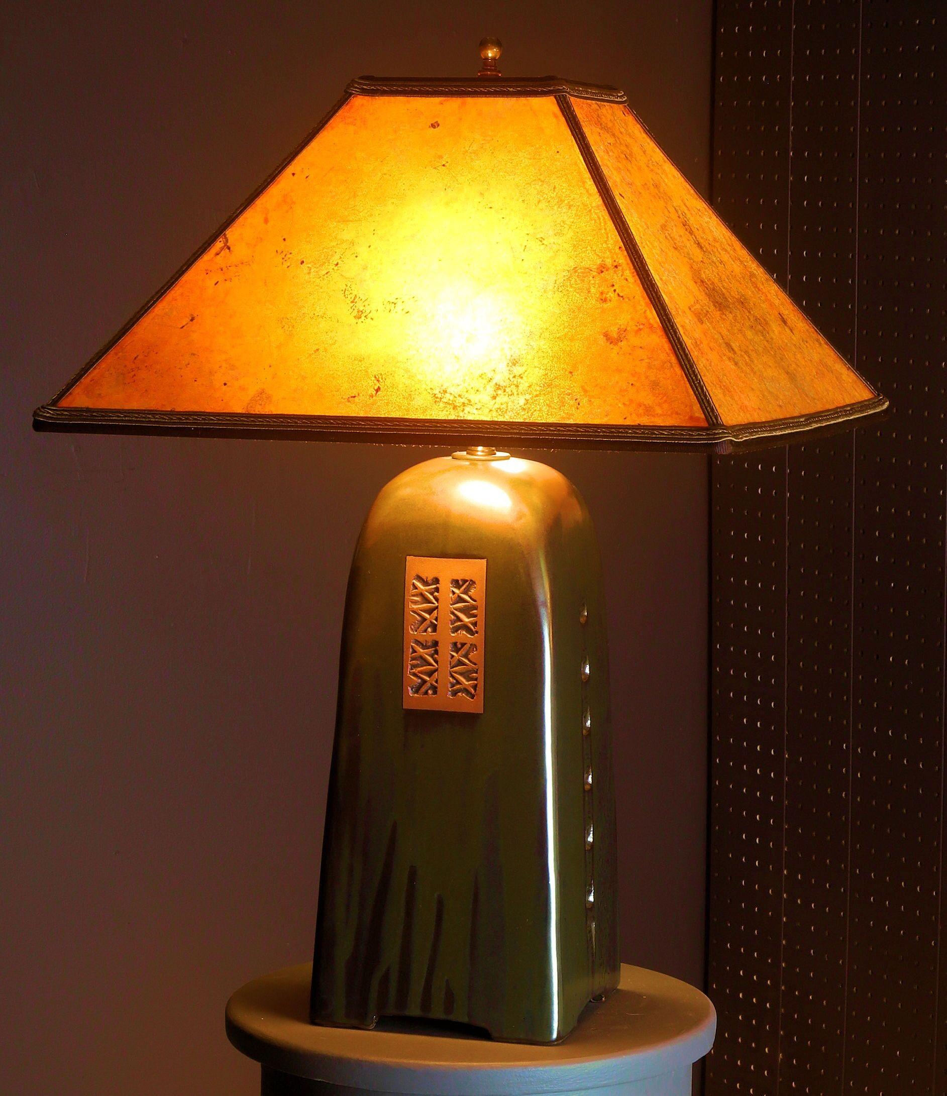 Beautiful handmade stoneware lamp by renowned artist Jim Webb. This is the North Union collection lamp in onyx glaze with amber mica shade.
Dimensions: Footprint 6 in x 6 in
Height of base without hardware 12.75 Total height to top of finial