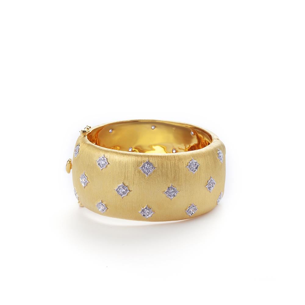 Stunning hand-engraved star pattern vermeil cuff bracelet. 

This Hand-engraved Gilded Sterling Cuff Bracelet features 28 pcs of around simulated diamonds handset in 18k yellow gold vermeil over sterling silver, and finished with Italian 