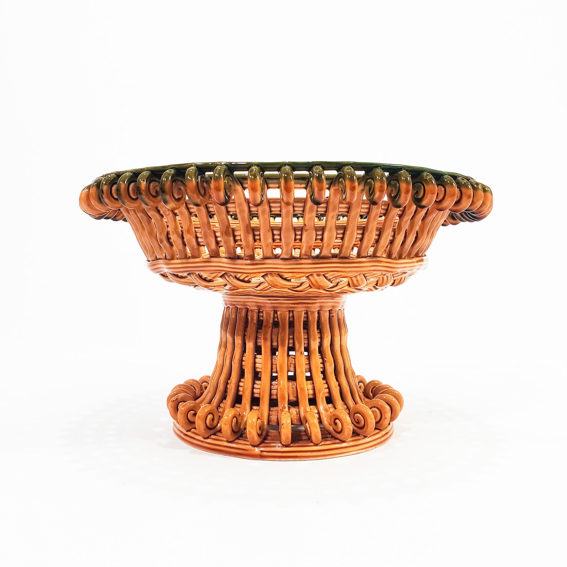 Big Spanish ceramic centerpiece or fruit bowl from Manises. It features a bowl-shaped body made with intertwined strips of ceramic, ending in spiral points both at the top and bottom. Made in mustard and bottle green tones. Mint condition. Very rare