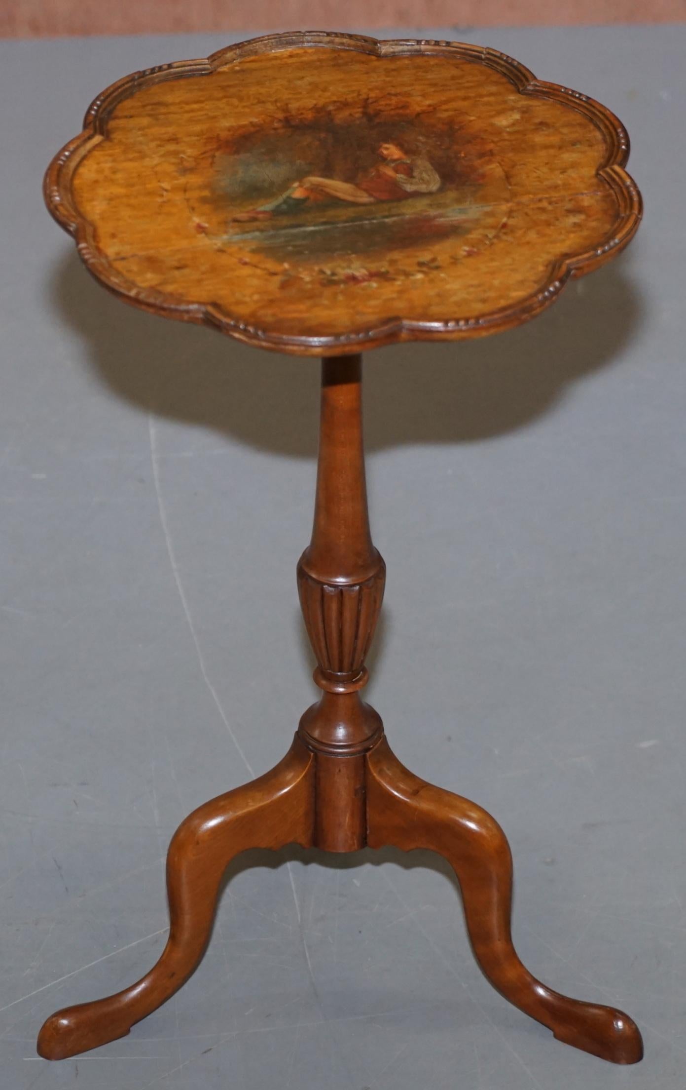 We are delighted to offer for sale this lovely mahogany Sheraton Revival hand painted lamp or wine table

A very good looking and well made piece, it mahogany with decorative Sheraton Revival painted piper boy to the top

We have cleaned waxed