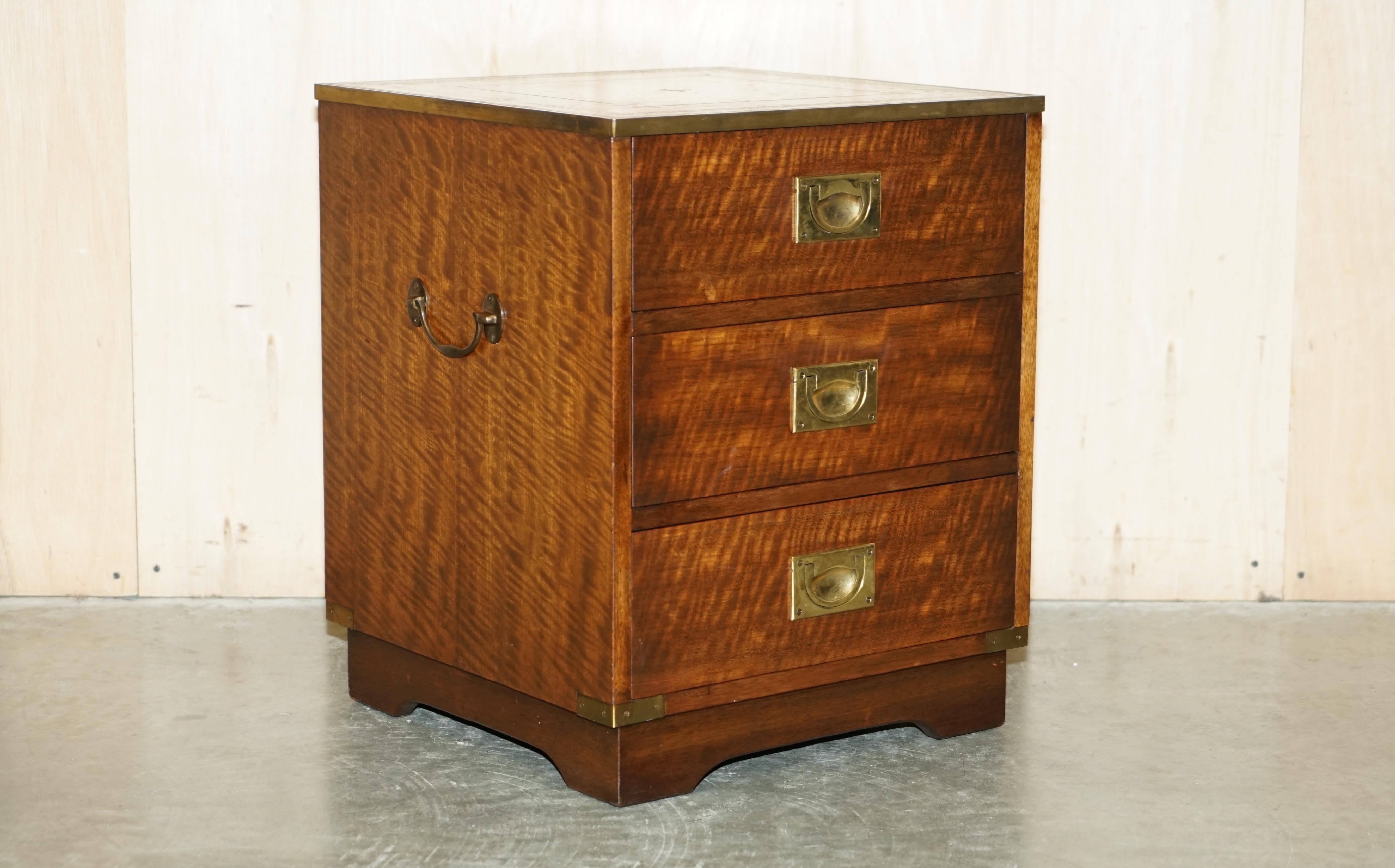 We are delighted to offer for sale this sublime vintage Harrods Kennedy Military Campaign side table with drawers and green leather top 

A truly stunning and well made piece by Kennedy Furniture and retailed through Harrods London. It works in