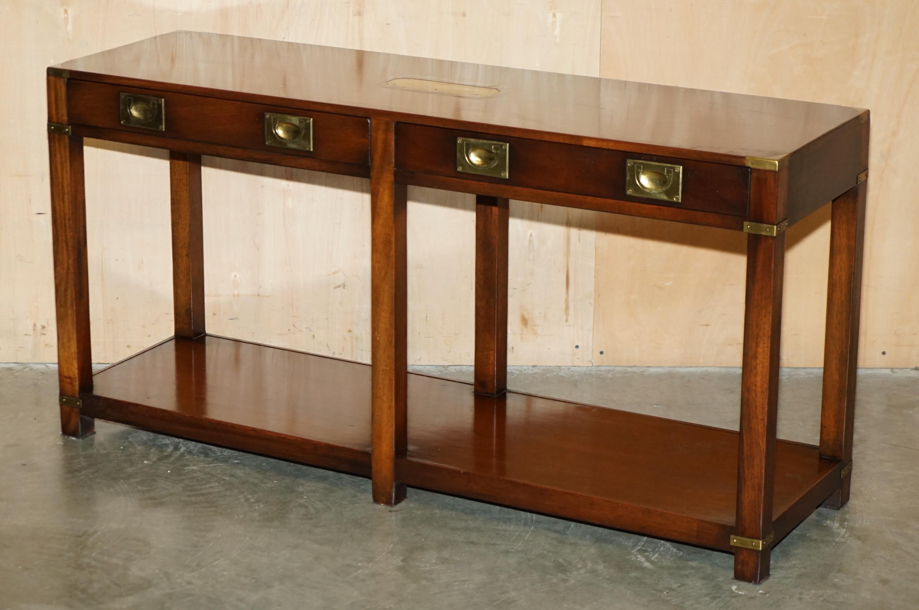 Royal House Antiques

Royal House Antiques is delighted to offer for sale this lovely Military campaign console table made by Kennedy and retailed through Harrods London with twin drawers

Please note the delivery fee listed is just a guide, it