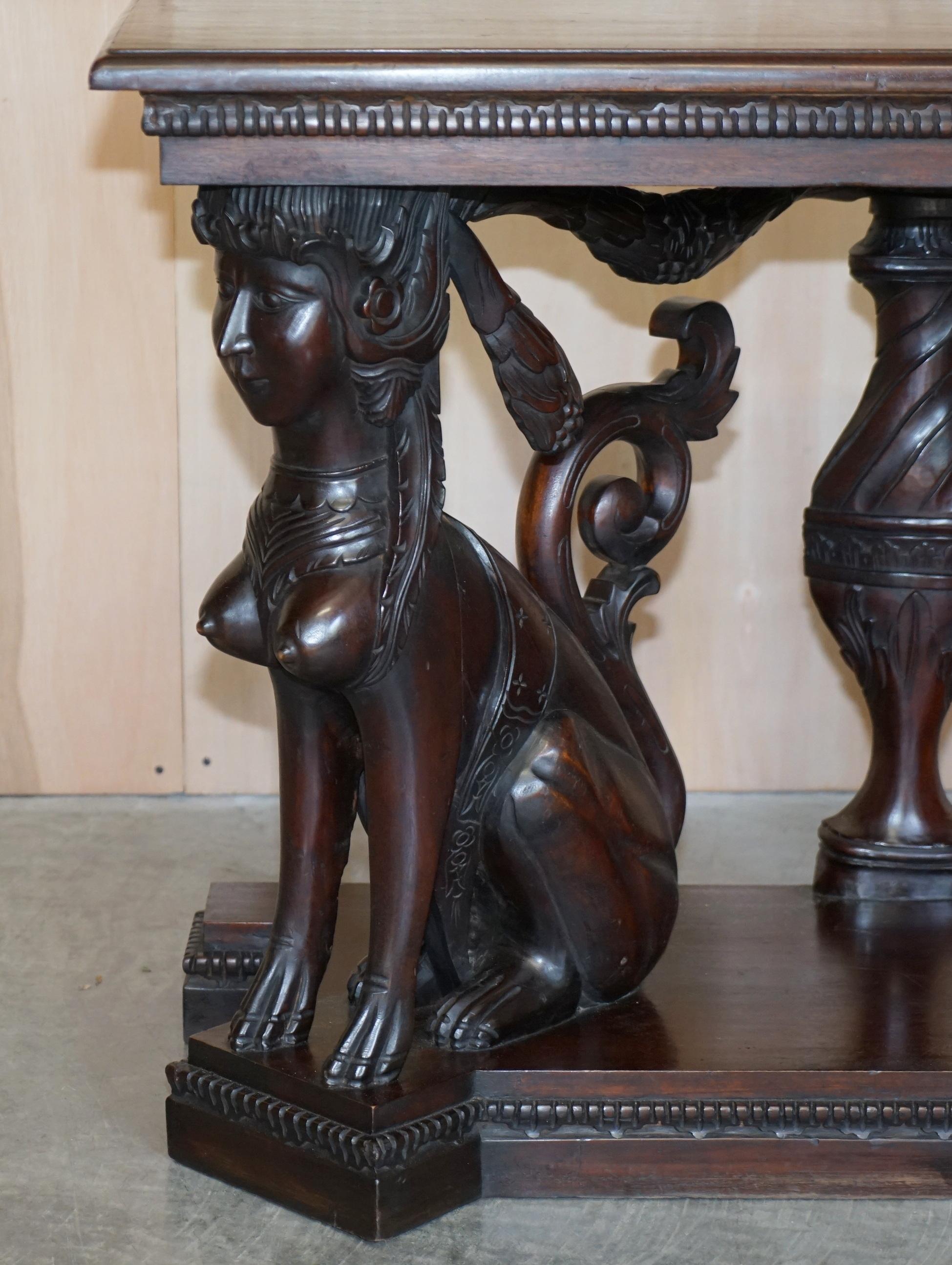 European Stunning Heavily Carved Egyptian Revival Console Table with Twin Sphinx Pillars For Sale
