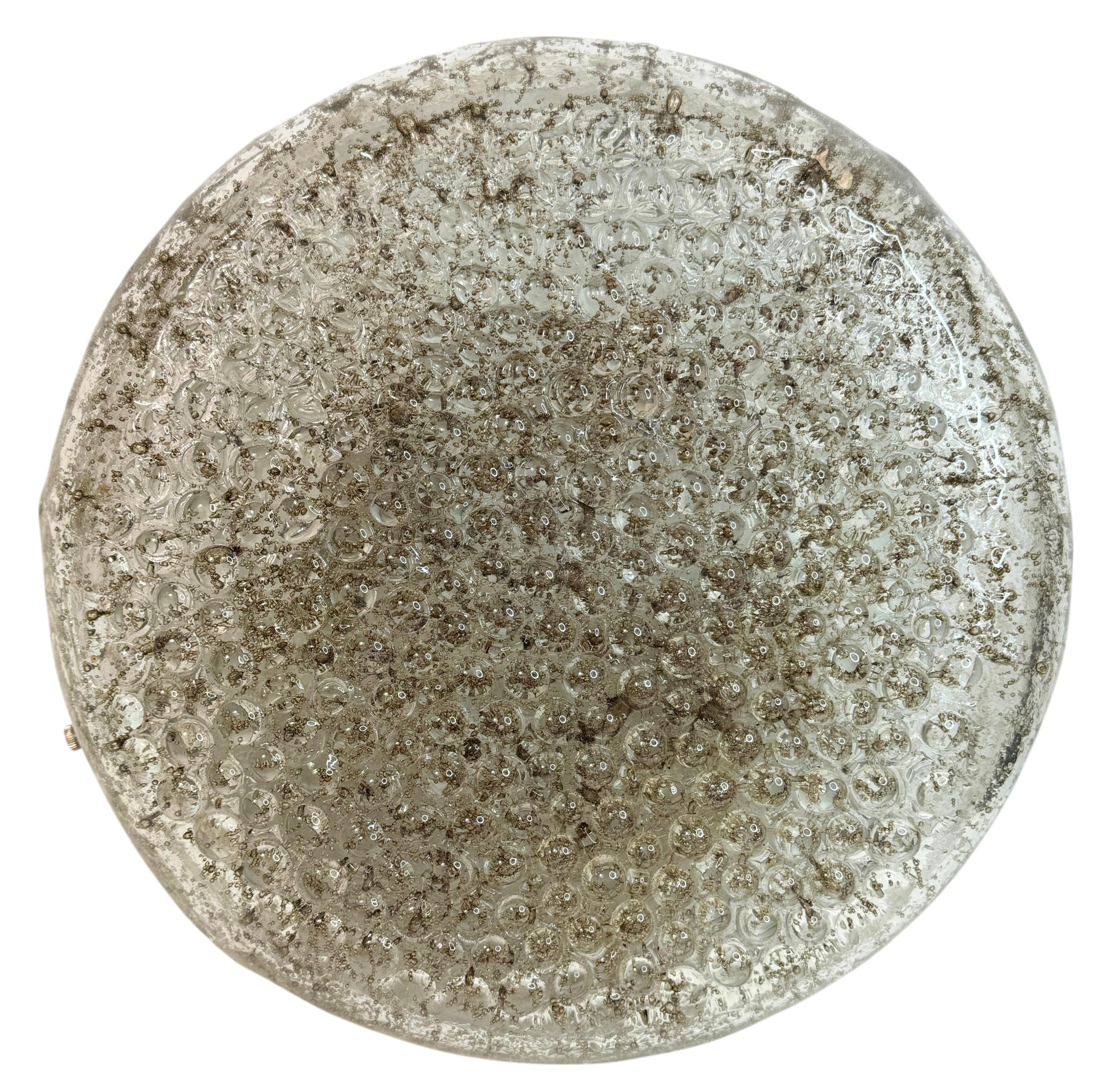 Beautiful flush mount with a heavy textured Murano glass on a silver lacquered metal fixture. It is a clear and brown bubblel glass. The Murano glass is fixed with three screws on the metal fixture. It requires four European E27 / 110 Volt Edison