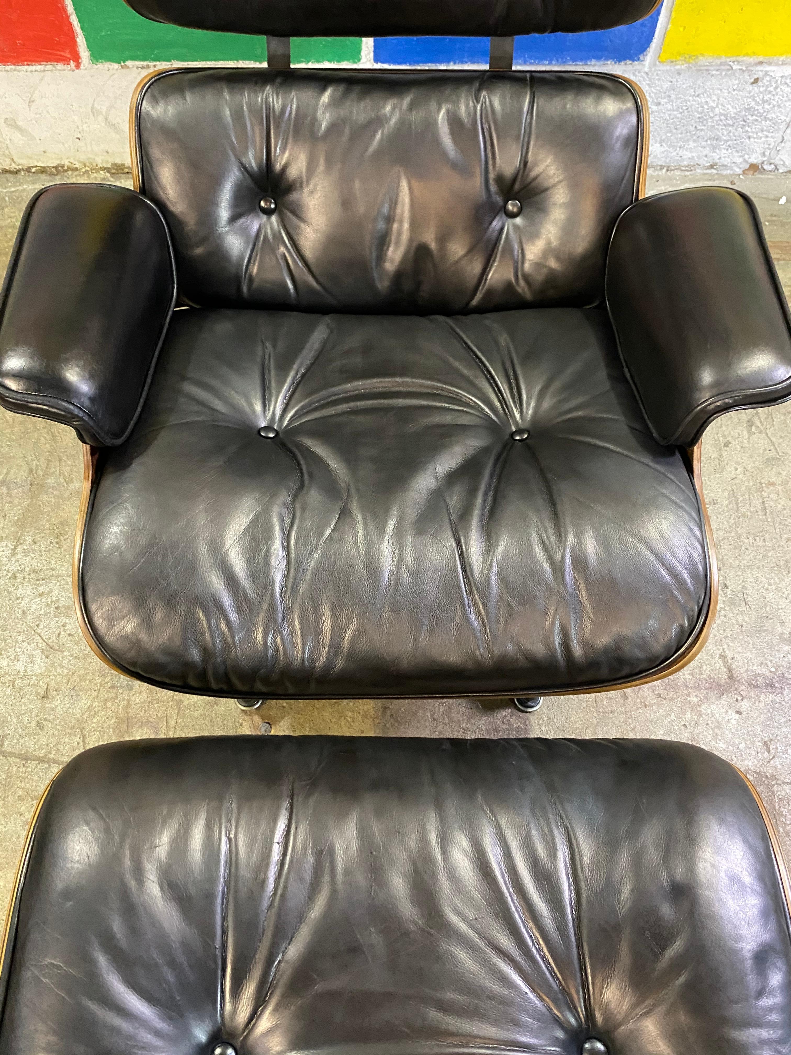 Gorgeous example of the classic Eames chair and ottoman. Signed guaranteed authentic vintage Herman Miller production. Wood has been cleaned and oiled. Leather in very good condition with no dryness or holes. Chair smoothly and chair and base retain