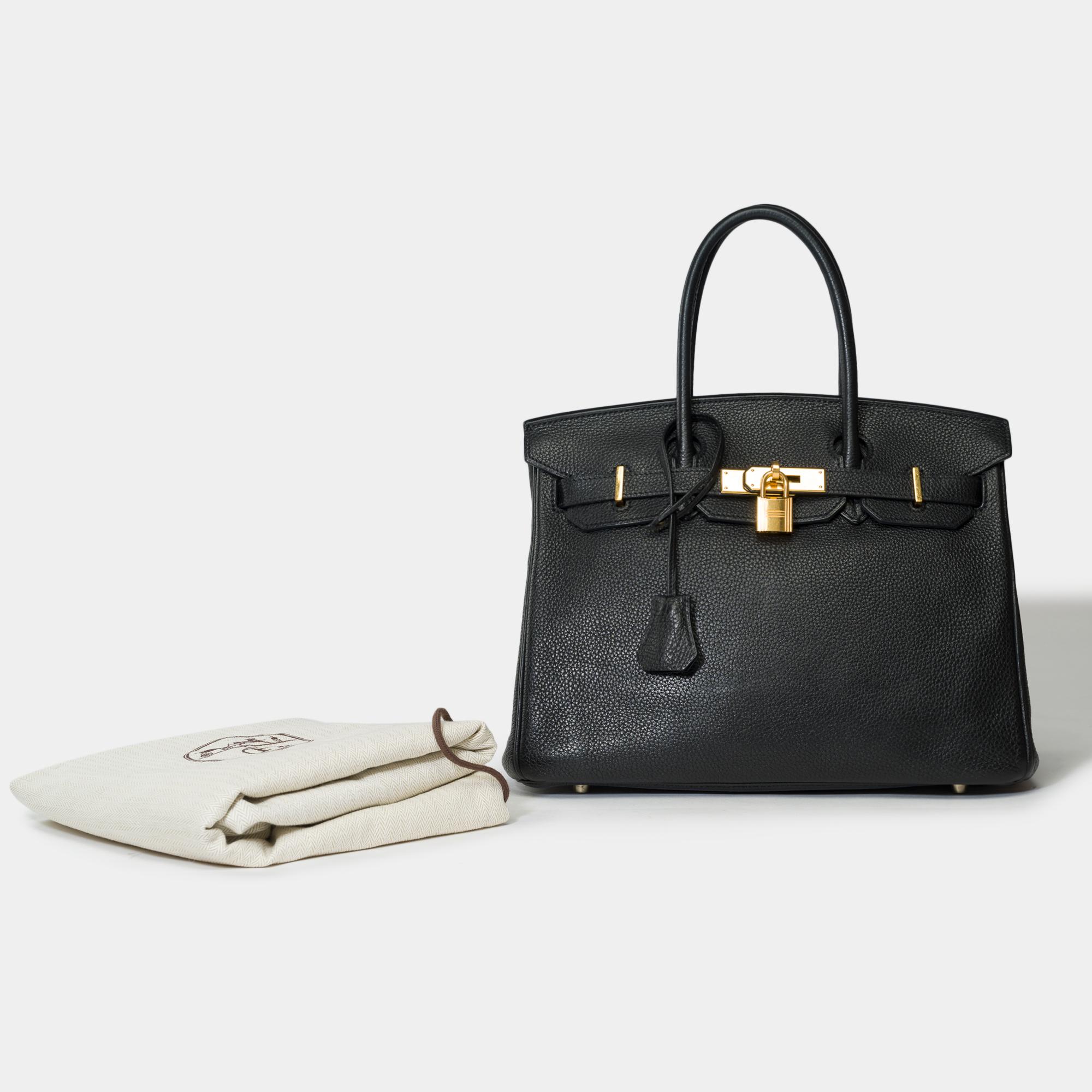Stunning​ ​Hermes​ ​Birkin​ ​30​ ​in​ ​Black​ ​Togo​ ​leather,​ ​gold​ ​plated​ ​metal​ ​trim​ ​,​ ​double​ ​handle​ ​in​ ​black​ ​leather​ ​allowing​ ​a​ ​hand​ ​carry

Flap​ ​closure
Black​ ​leather​ ​inner​ ​lining​ ​,​ ​a​ ​zippered​ ​pocket,​