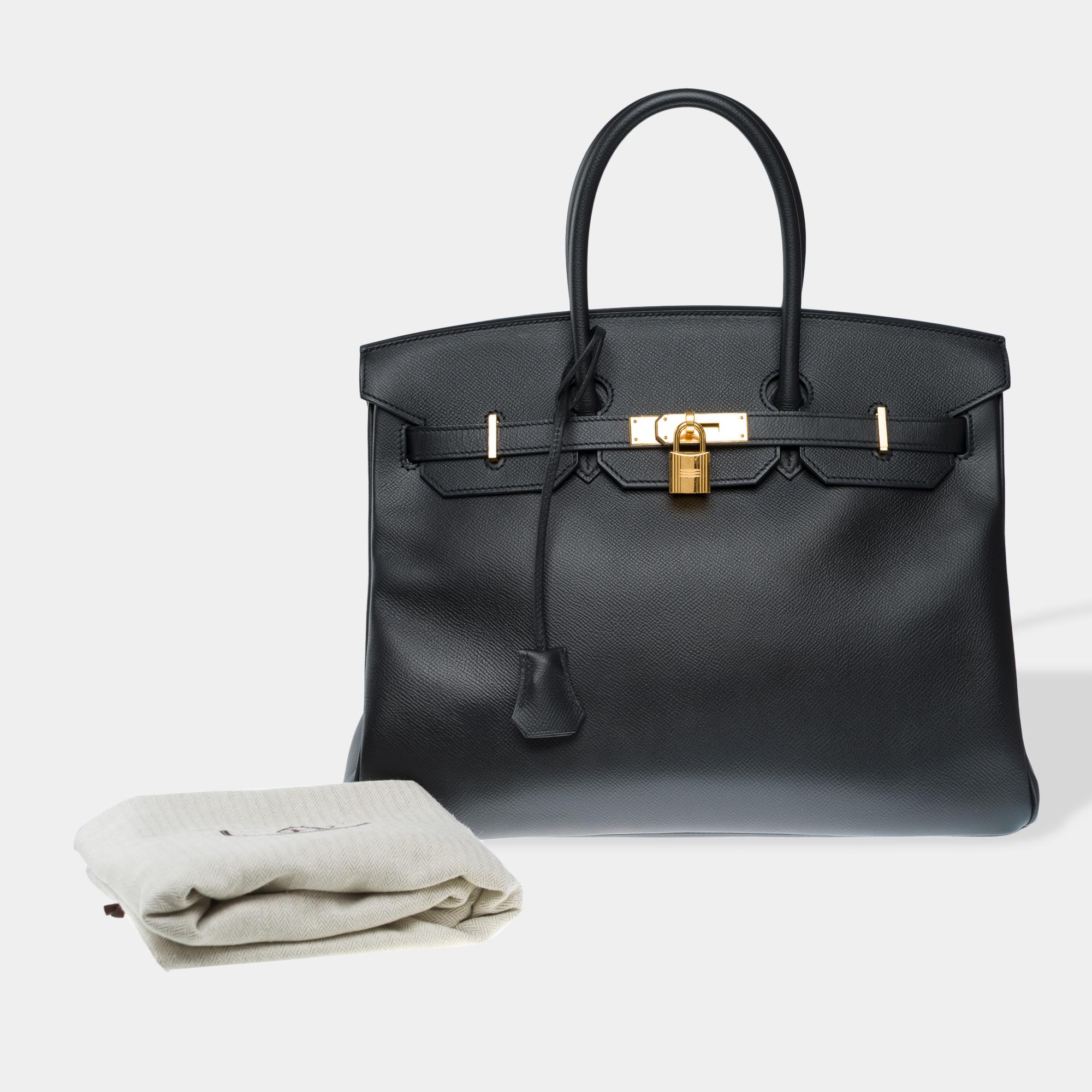 Exceptional​ ​Hermes​ ​Birkin​ ​35​ ​handbag​ ​in​ ​black​ ​Epsom​ ​calf​ ​leather,​ ​with​ ​gold​ ​metal​ ​trim,​ ​double​ ​black​ ​leather​ ​handles​ ​for​ ​hand​ ​carry

Flap​ ​closure
Black​ ​leather​ ​lining,​ ​one​ ​zip​ ​pocket,​ ​one​ ​flat​