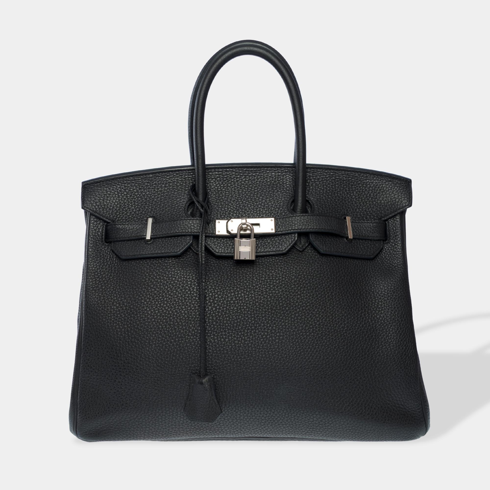 Splendid​ ​Hermes​ ​Birkin​ ​35​ ​handbag​ ​in​ ​black​ ​Togo​ ​leather,​ ​palladium​ ​silver​ ​trim,​ ​double​ ​black​ ​leather​ ​handle​ ​for​ ​hand​ ​carrying

Flap​ ​closure
Black​ ​leather​ ​interior​ ​lining,​ ​one​ ​zipped​ ​pocket​ ​One​
