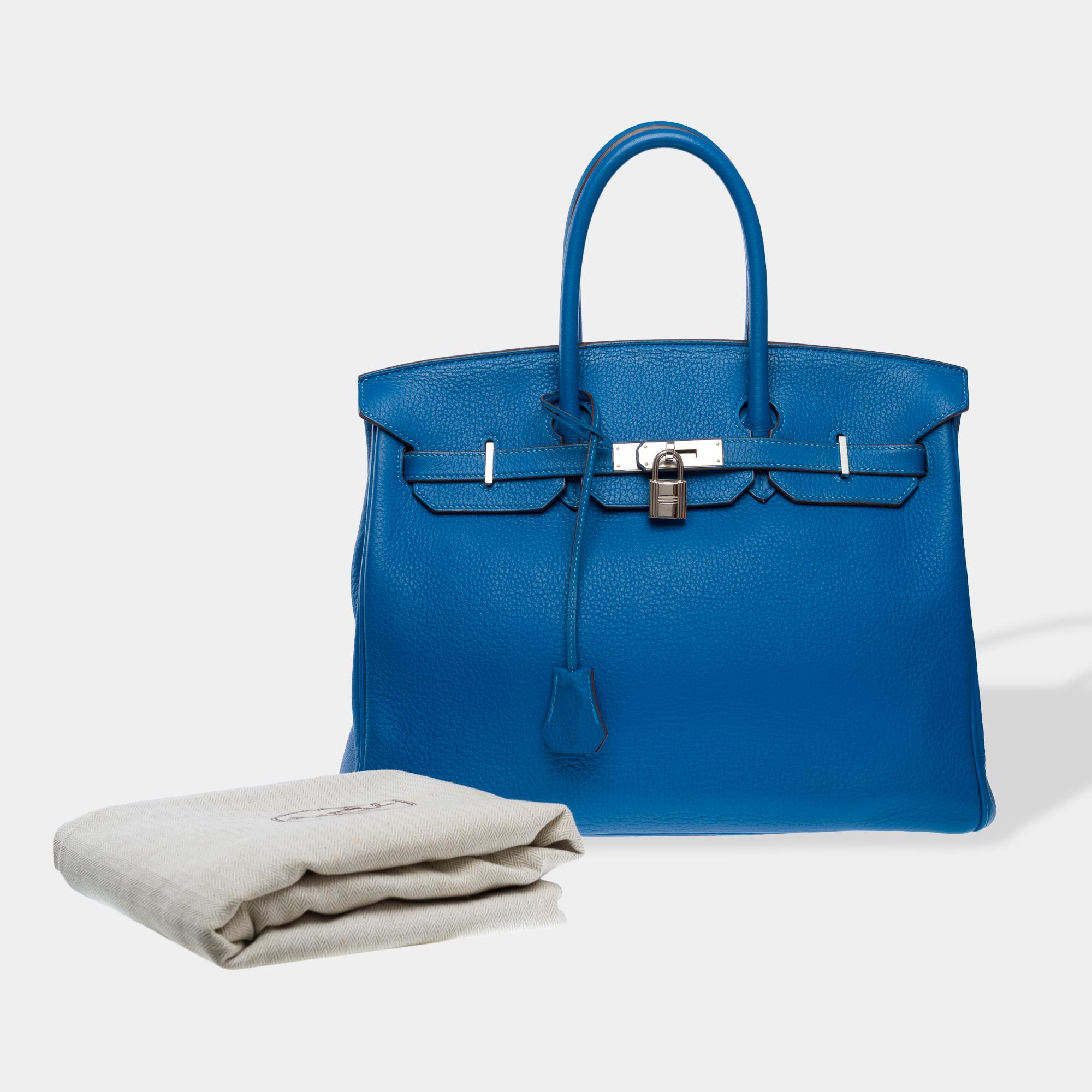 Sublime​ ​Hermes​ ​Birkin​ ​35​ ​handbag​ ​in​ ​Blue​ ​Izmir​ ​Togo​ ​calf​ ​leather,​ ​silver​ ​Palladium​ ​metal​ ​hardware,​ ​double​ ​blue​ ​leather​ ​handles​ ​for​ ​hand​ ​carry.

Flap​ ​closure
Blue​ ​leather​ ​interior​ ​lining,​ ​one​ ​zip​