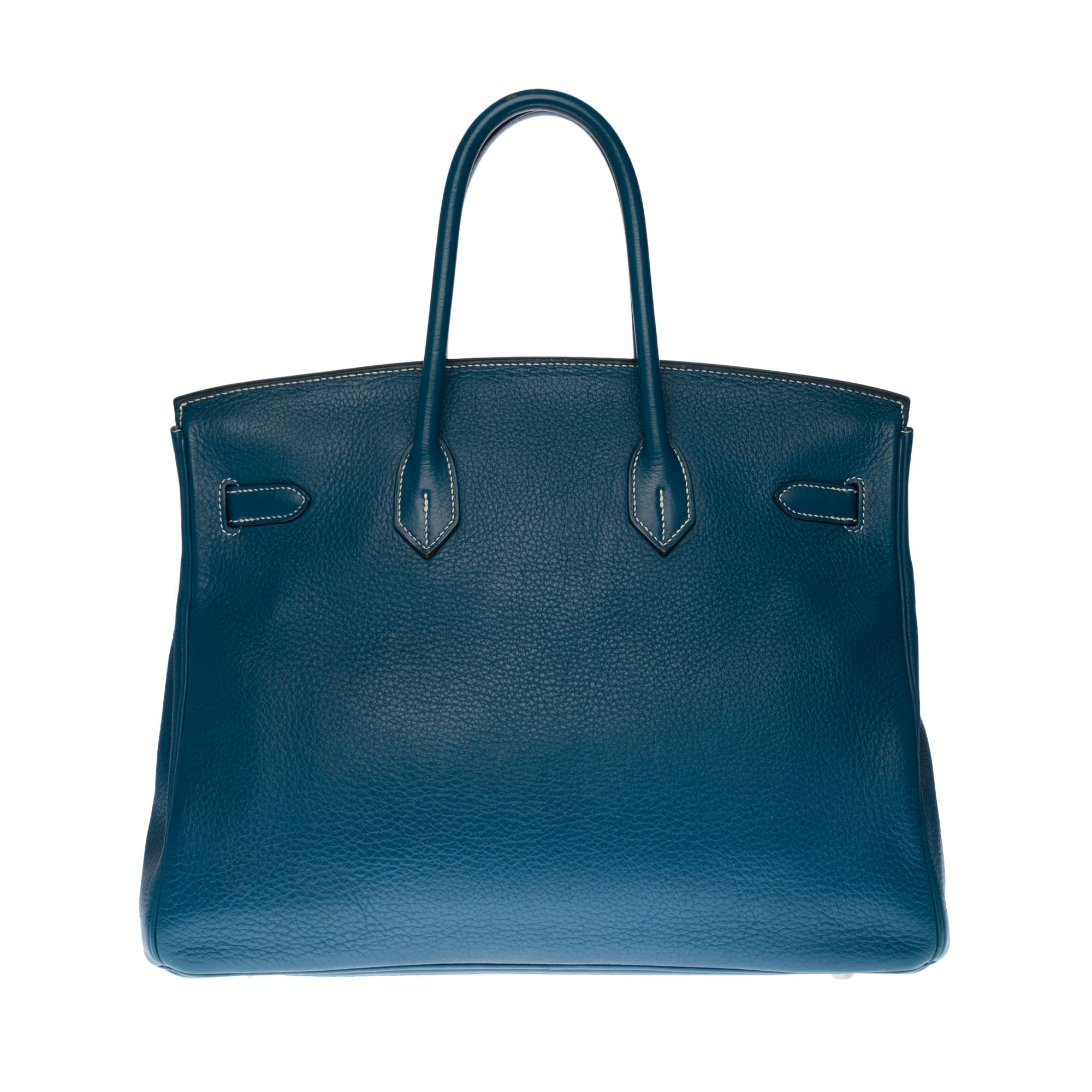 Stunning Hermes Birkin 35 cm handbag in Thalassa blue Taurillon leather with white stitching, palladium silver metal hardware, double handle in blue leather allowing a handheld
Closure by flap
Lining in blue leather, a zipped pocket, a patch