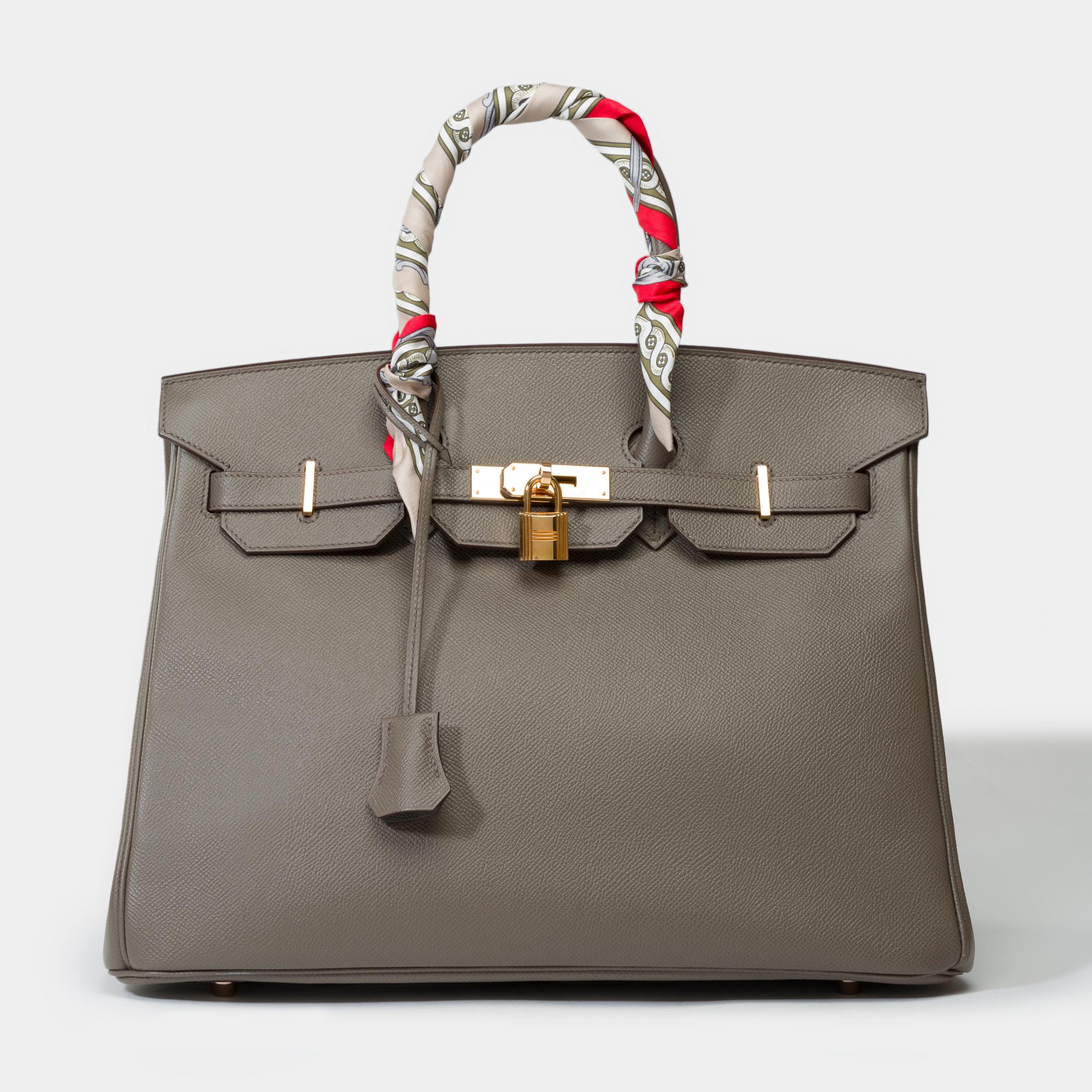 Rare​ ​Hermes​ ​Birkin​ ​35​ ​handbag​ ​in​ ​Etoupe​ ​Epsom​ ​leather,​ ​pink​ ​gold​ ​plated​ ​metal​ ​trim,​ ​double​ ​grey​ ​leather​ ​handle​ ​for​ ​hand​ ​carry

Flap​ ​closure
Grey​ ​leather​ ​interior​ ​lining,​ ​a​ ​zippered​ ​pocket,​ ​a​