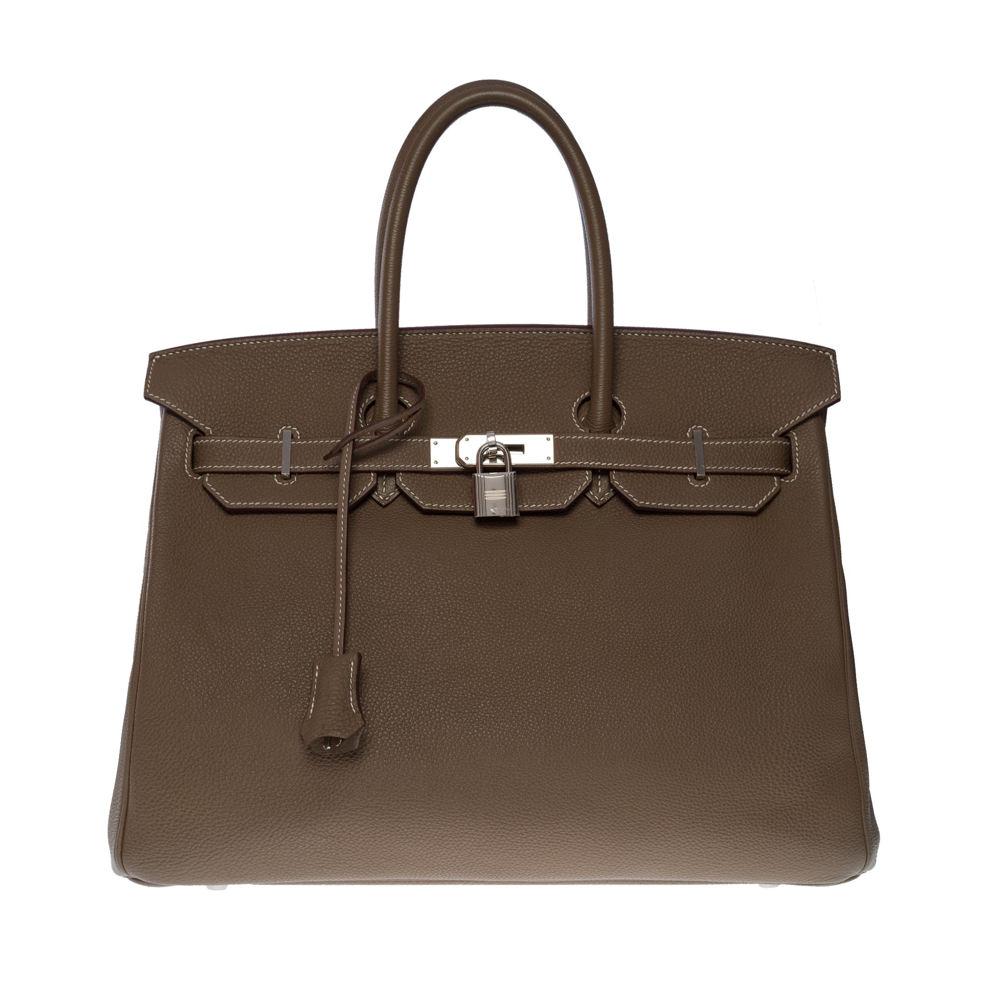 Stunning Hermes Birkin 35 handbag in Togo leather white stitching, Palladium silver metal hardware, double handle in Togo leather allowing a hand-carried

Flap closure
Inside lining in towed leather, one zippered pocket, one patch pocket
Signature: