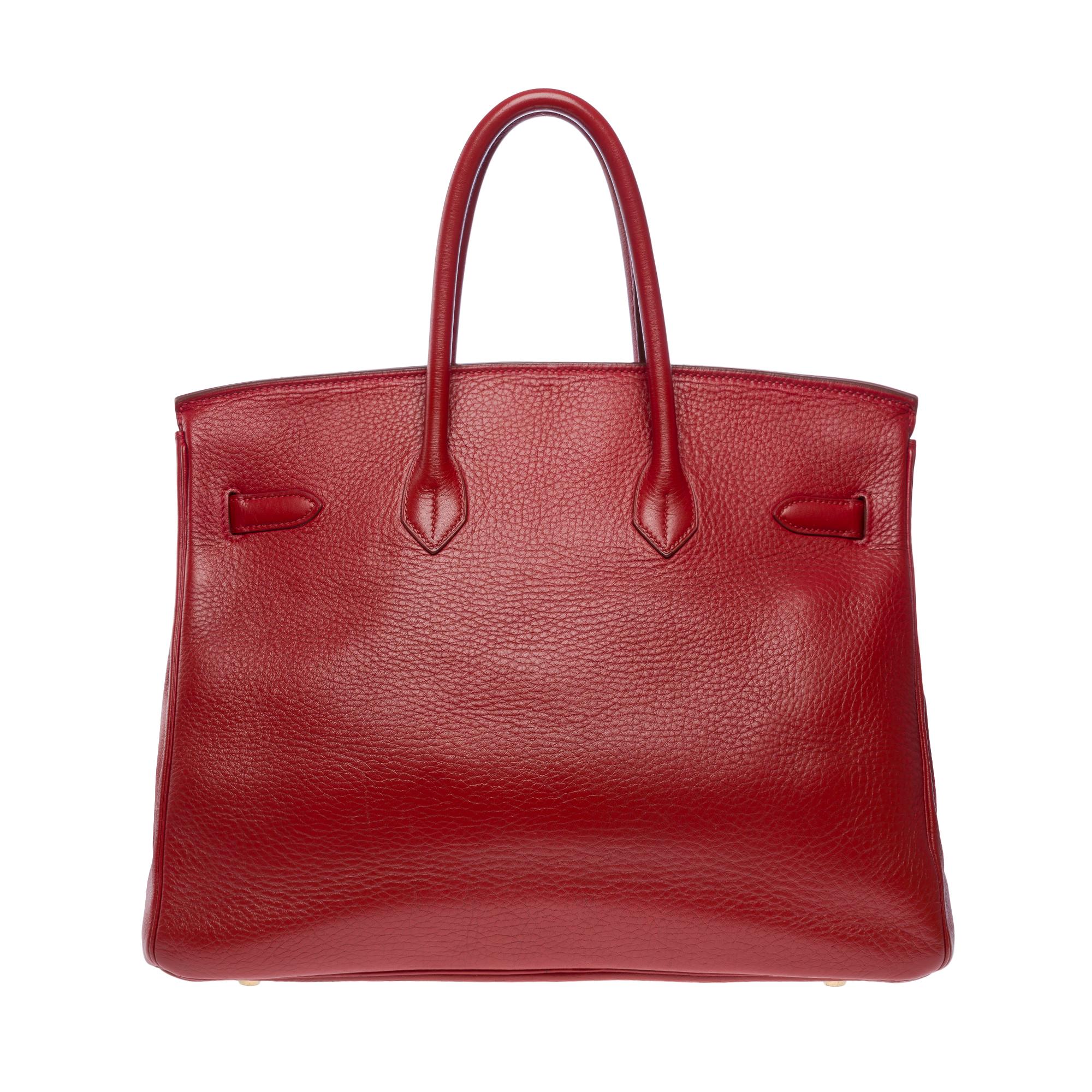 Stunning Hermes Birkin 35 in Rouge Garance Togo leather , gold plated metal hardware, double handle in red leather for hand carry

Flap closure
Interior lining in red leather, one zipped pocket, one patch pocket
Signature: 