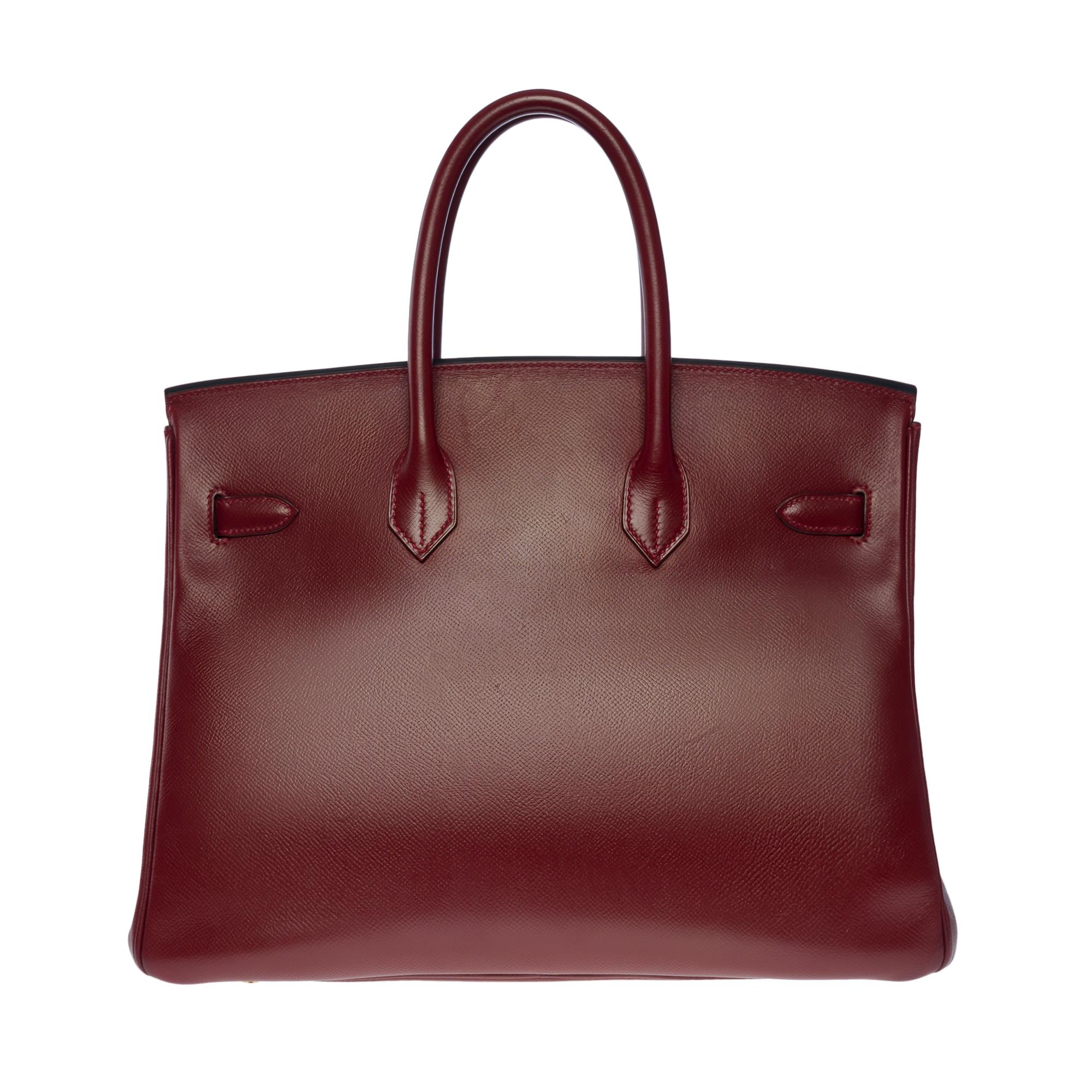 Amazing Hermes Birkin 35 handbag in Red H epsom leather (Burgundy), gold plated metal hardware, double handle in burgundy leather allowing a hand-carried

Flap closure
Burgundy leather lining, one zippered pocket, one patch pocket
Signature: 