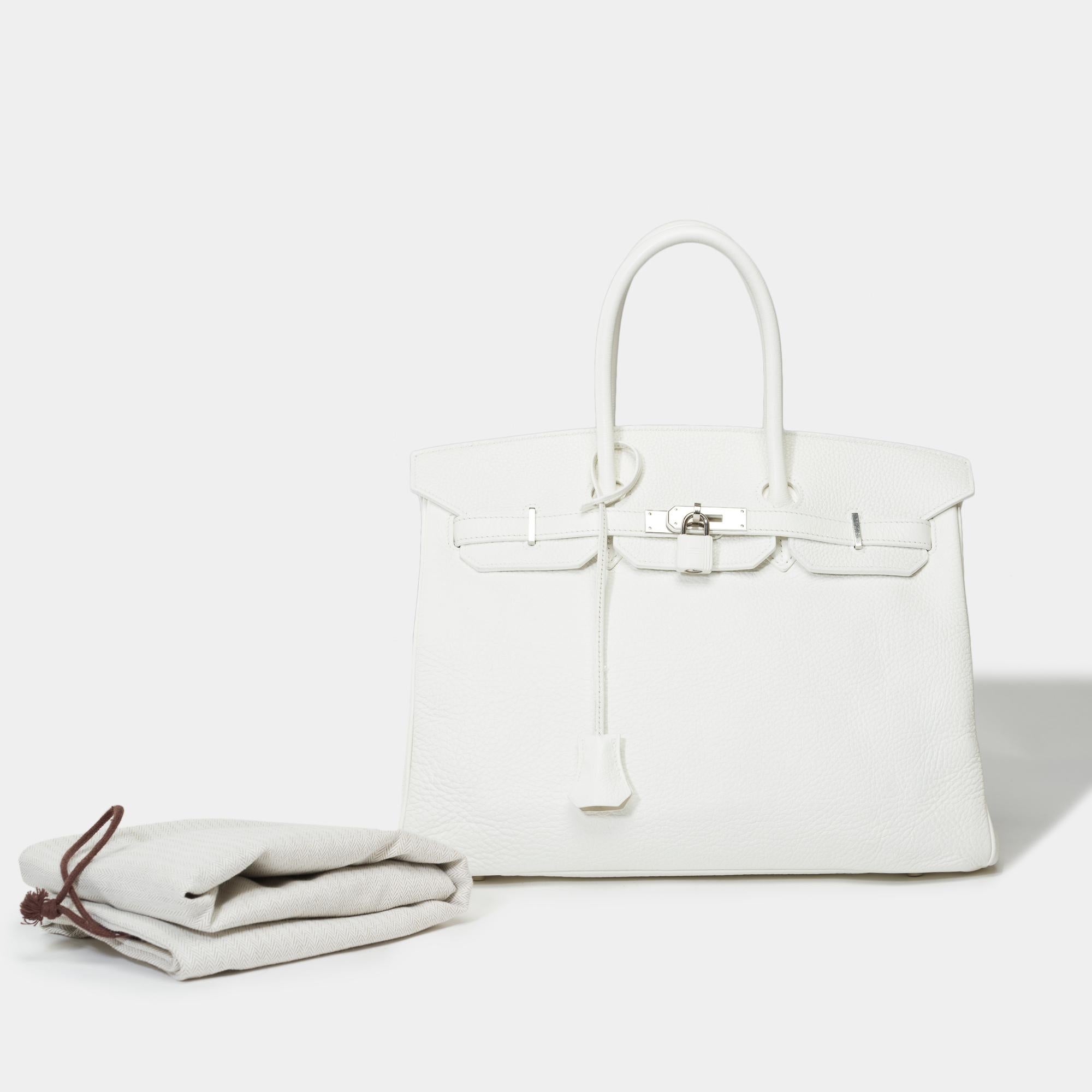 Stunning​ ​Hermes​ ​Birkin​ ​35​ ​handbag​ ​in​ ​White​ ​Taurillon​ ​Clemence​ ​leather,​ ​silver​ ​palladium​ ​metal​ ​trim,​ ​double​ ​handle​ ​in​ ​white​ ​leather​ ​for​ ​a​ ​hand​ ​carry

Flap​ ​closure
White​ ​leather​ ​inner​ ​lining,​ ​one​