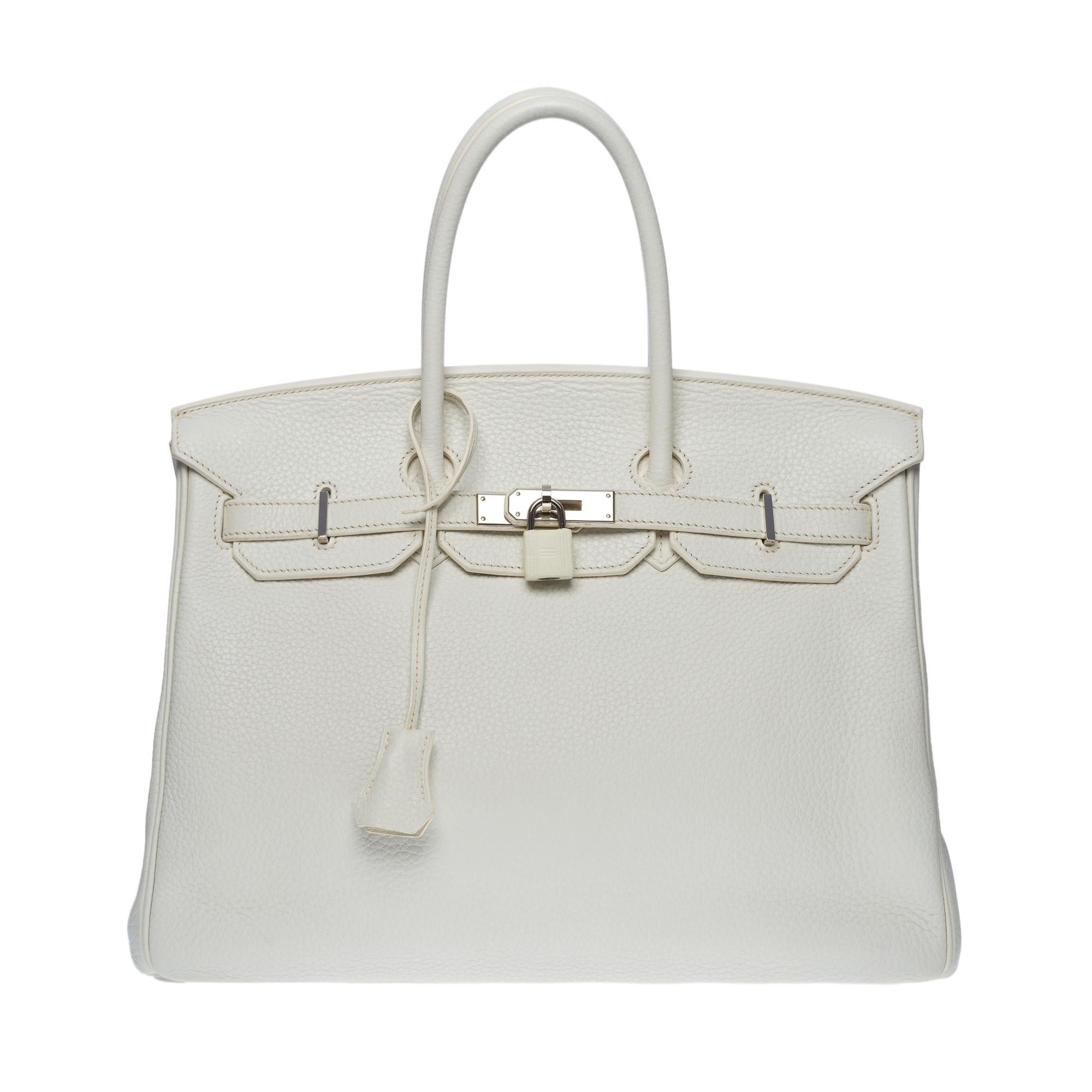 Splendid Hermes Birkin 35 handbag in white Togo leather, palladium silver metal hardware, double white leather handle allowing a hand-carry
Flap closure
White leather lining, one zippered pocket, one patch pocket
Signature: 